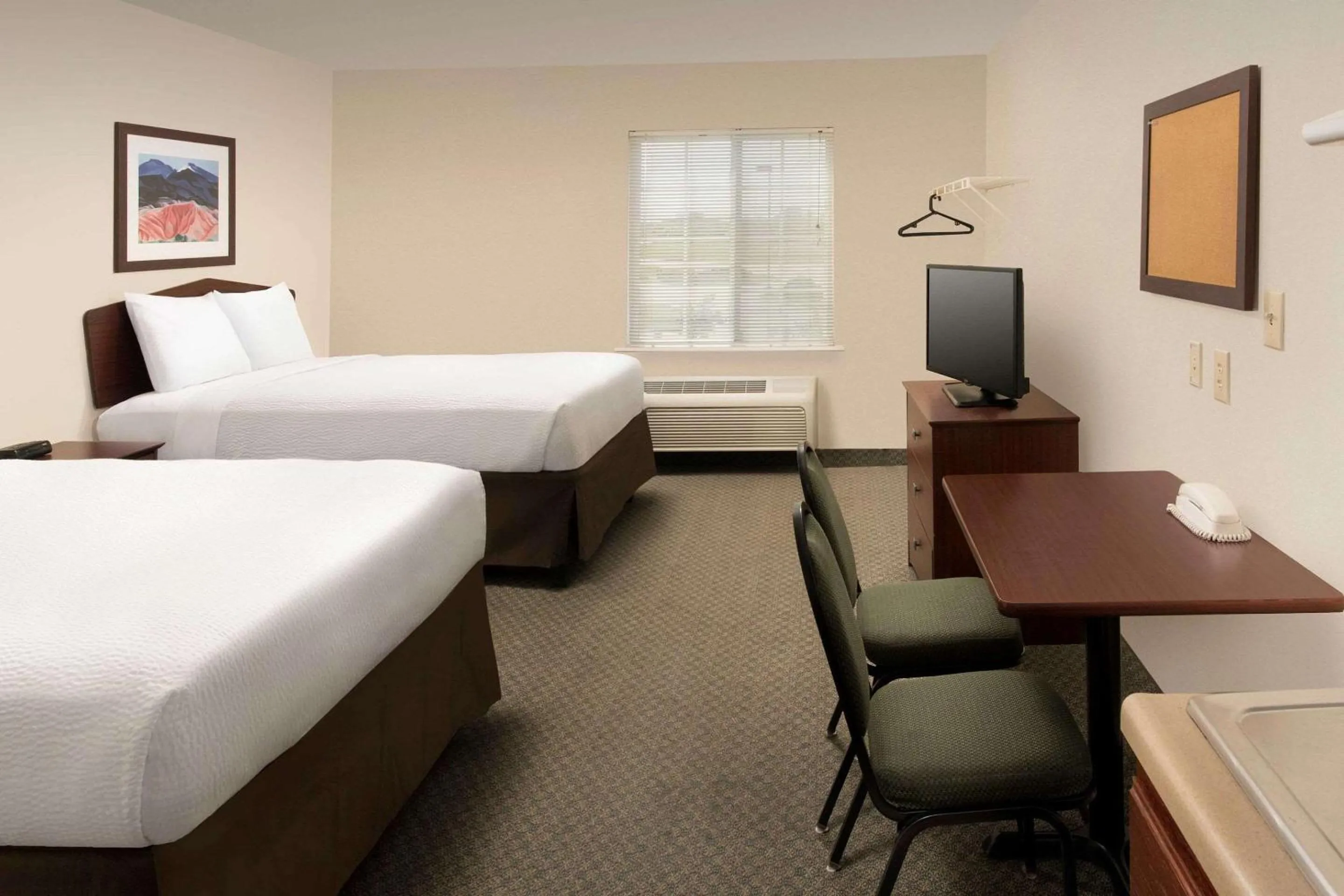 Photo of the whole room, Bed in WoodSpring Suites Waco near University
