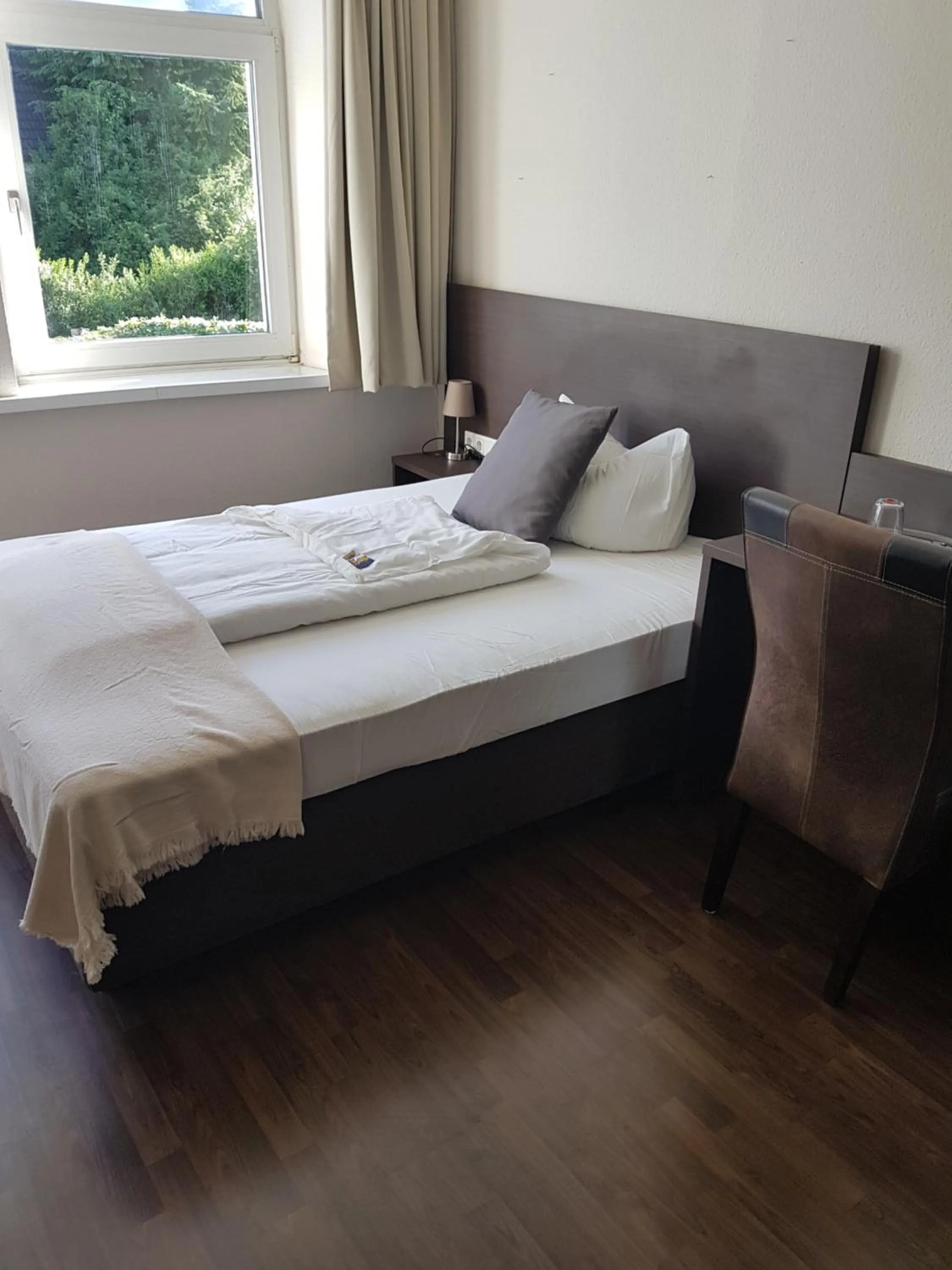 Photo of the whole room, Bed in Weltmann`s Hotel & Restaurant
