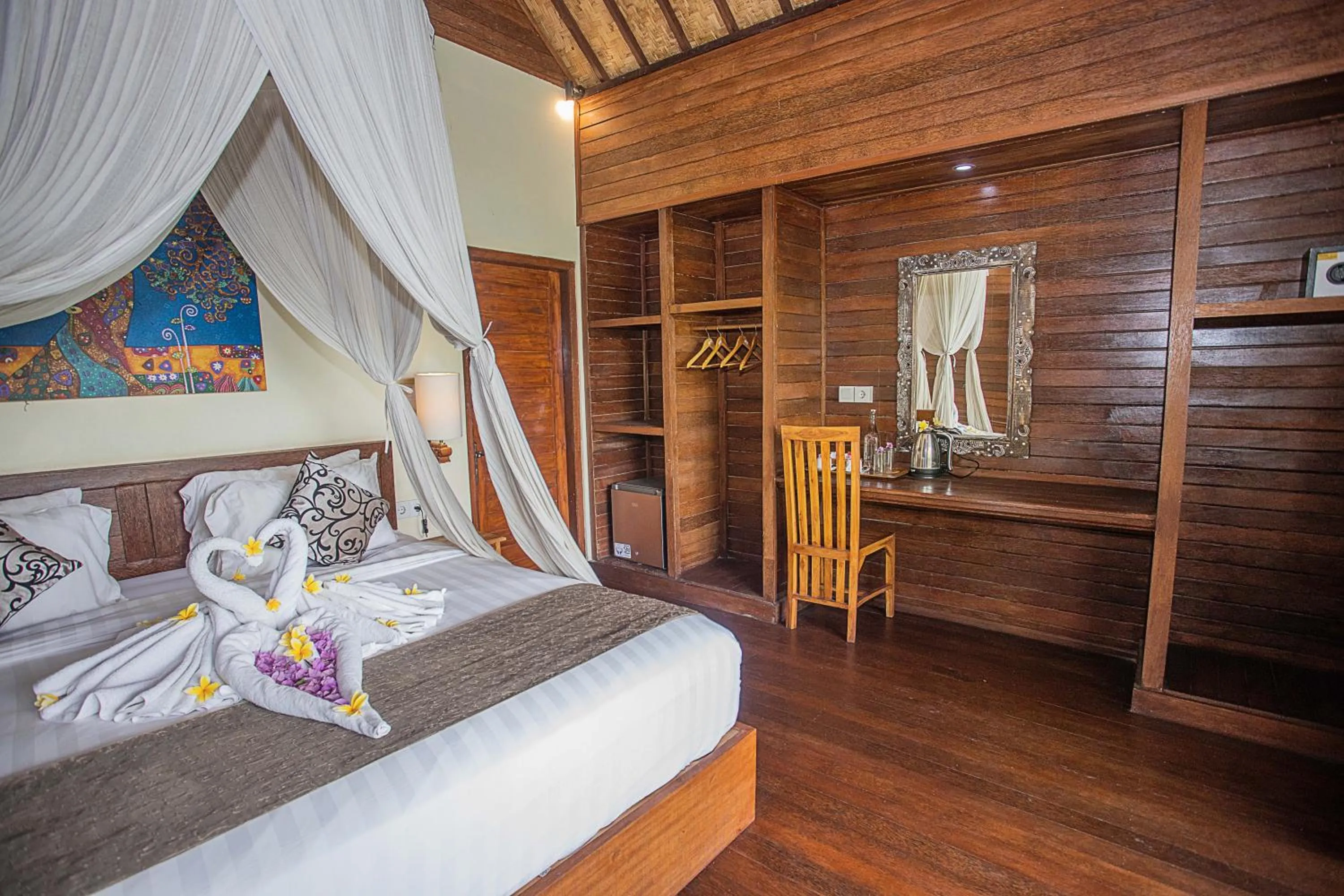 Seating area, Bed in D'Muncuk Huts Lembongan