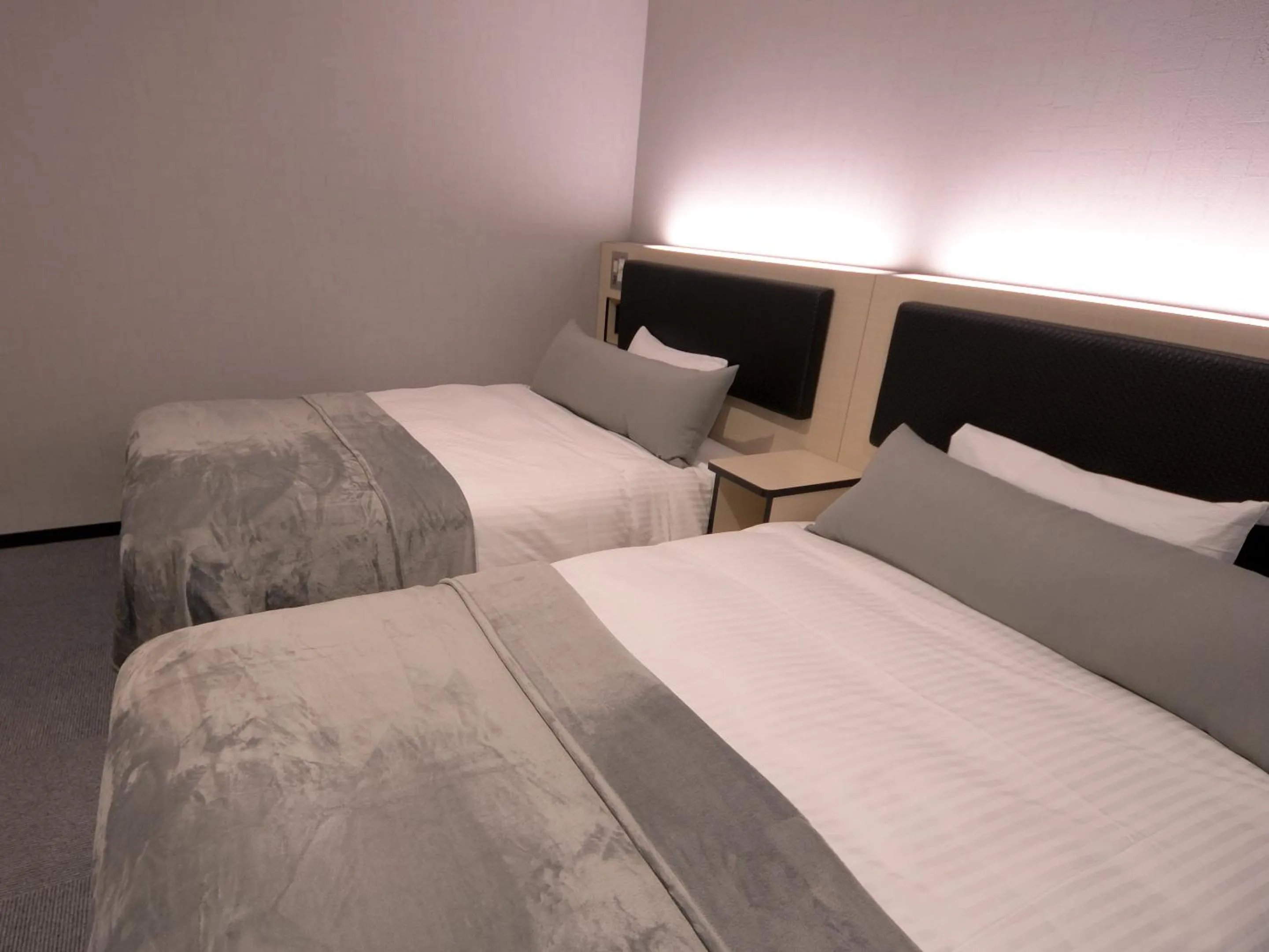 Bed in Green Rich Hotel Tottori Ekimae (Artificial hot spring Futamata Yunohana)