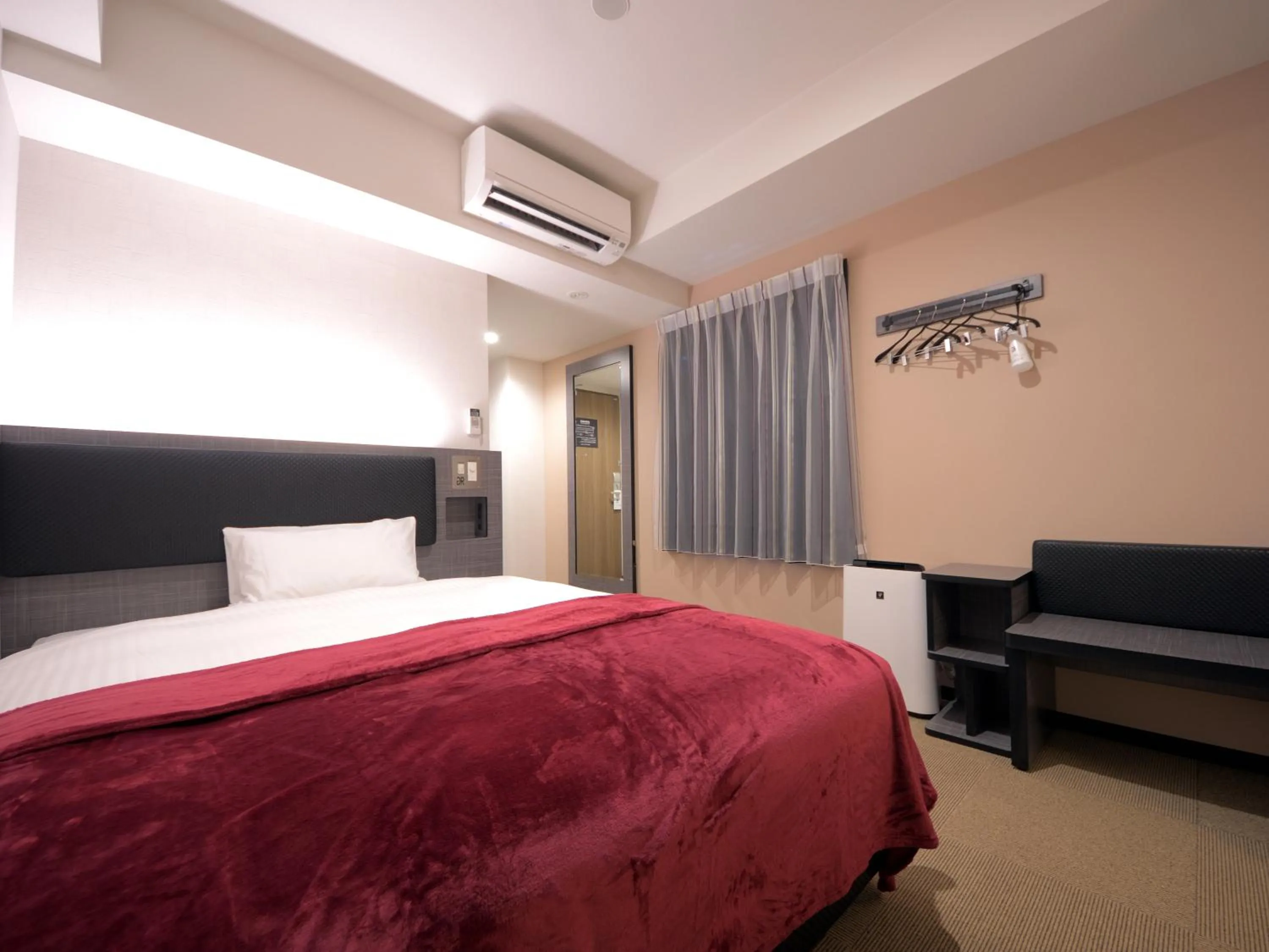 Bed in Green Rich Hotel Tottori Ekimae (Artificial hot spring Futamata Yunohana)