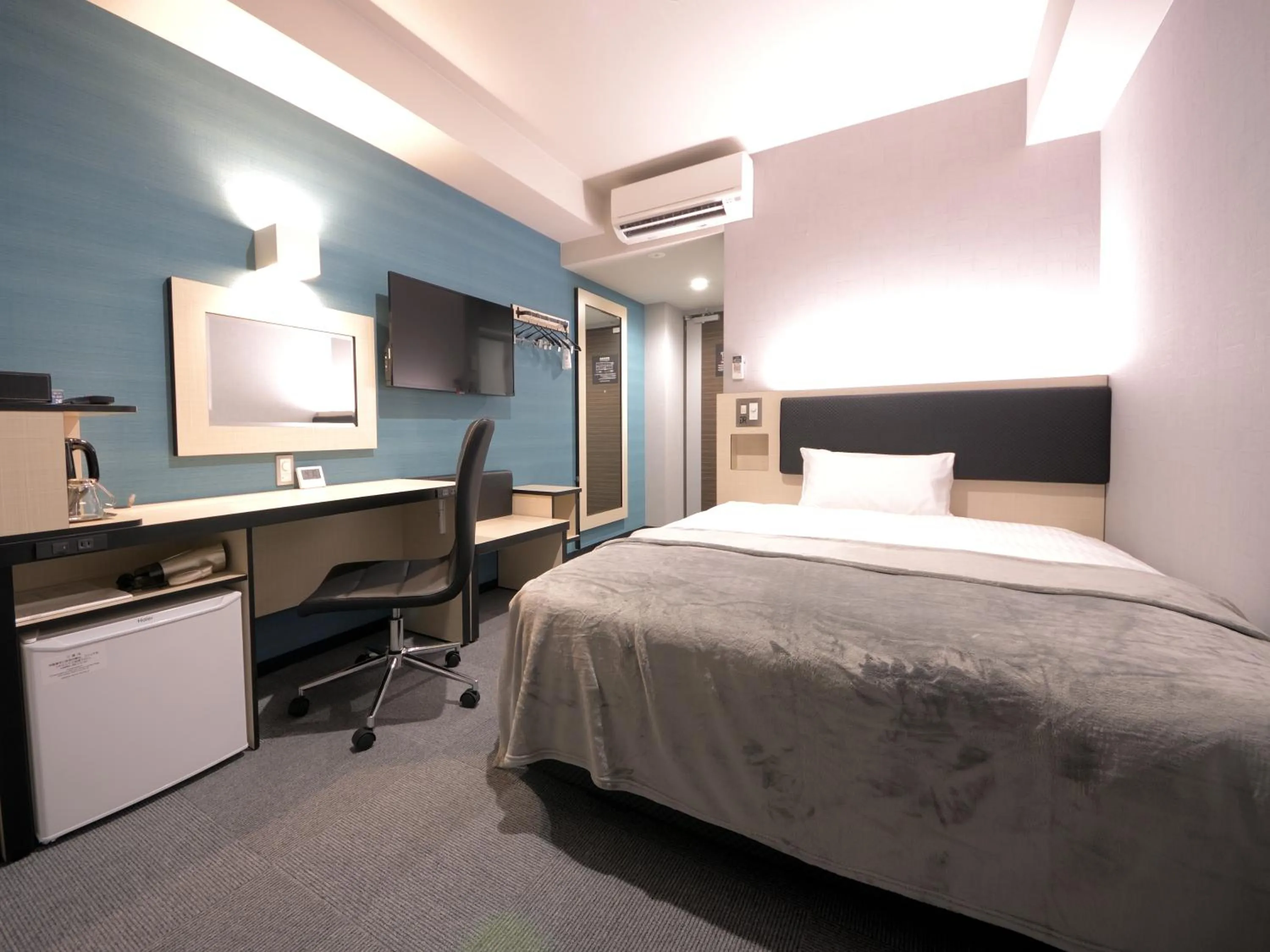 Bed in Green Rich Hotel Tottori Ekimae (Artificial hot spring Futamata Yunohana)