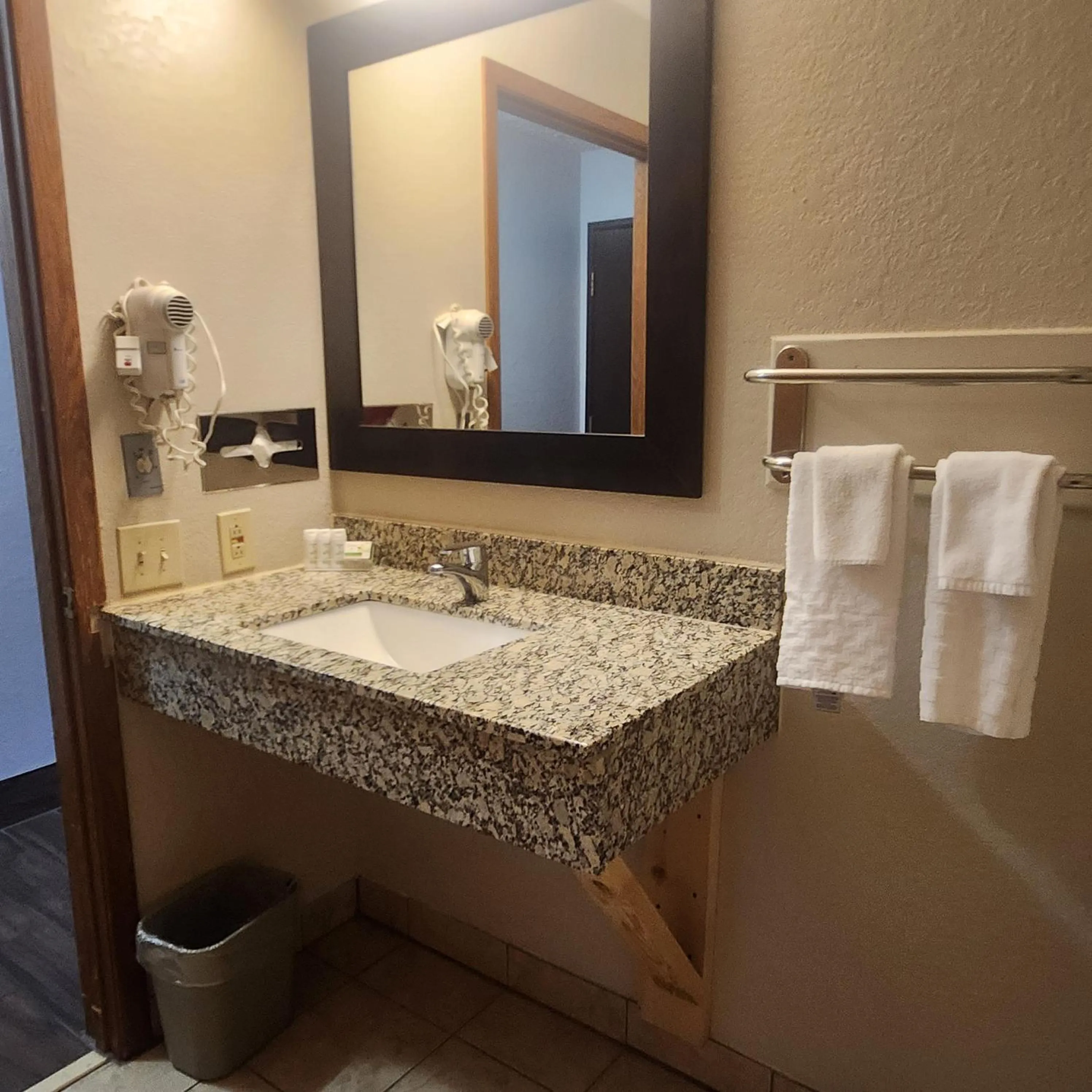 Bathroom in Ramada by Wyndham Cedar Rapids South