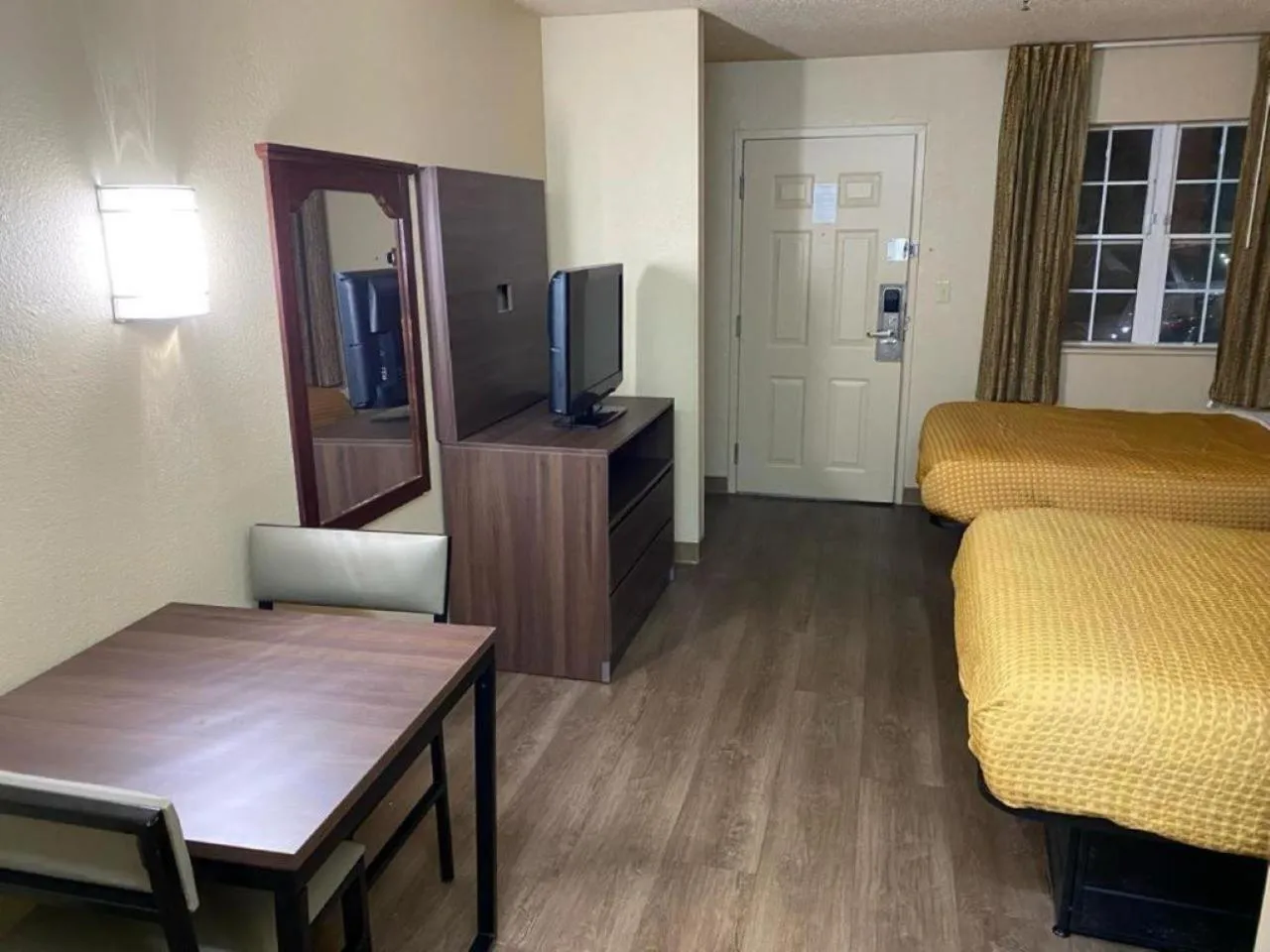 Bed in Suburban Studios Winston-Salem near Hanes Mall