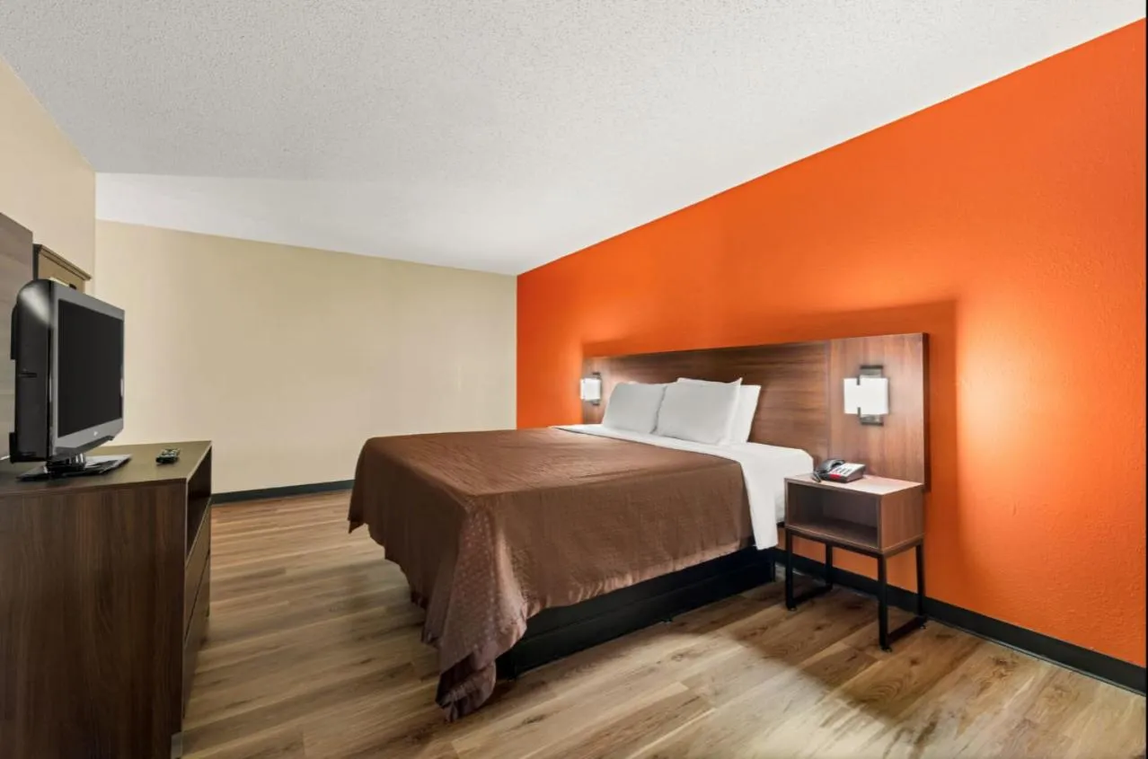 Bed in Suburban Studios Winston-Salem near Hanes Mall