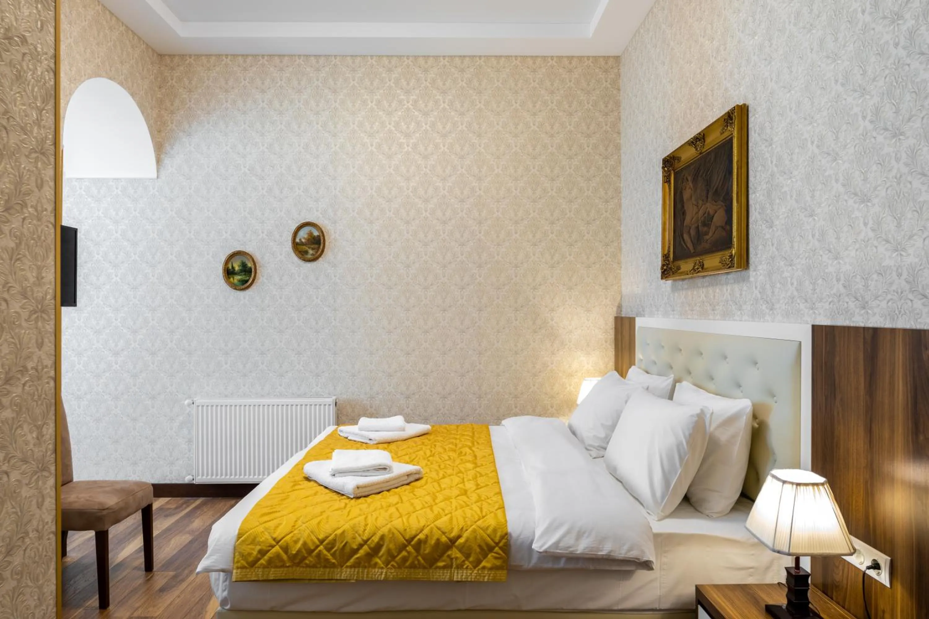 Bed in Ornament Hotel