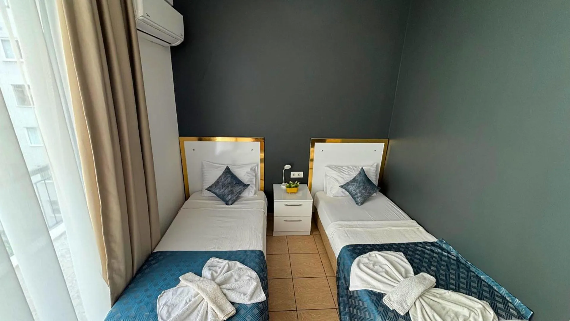 Bed in MOONBOW BEACH HOTEL