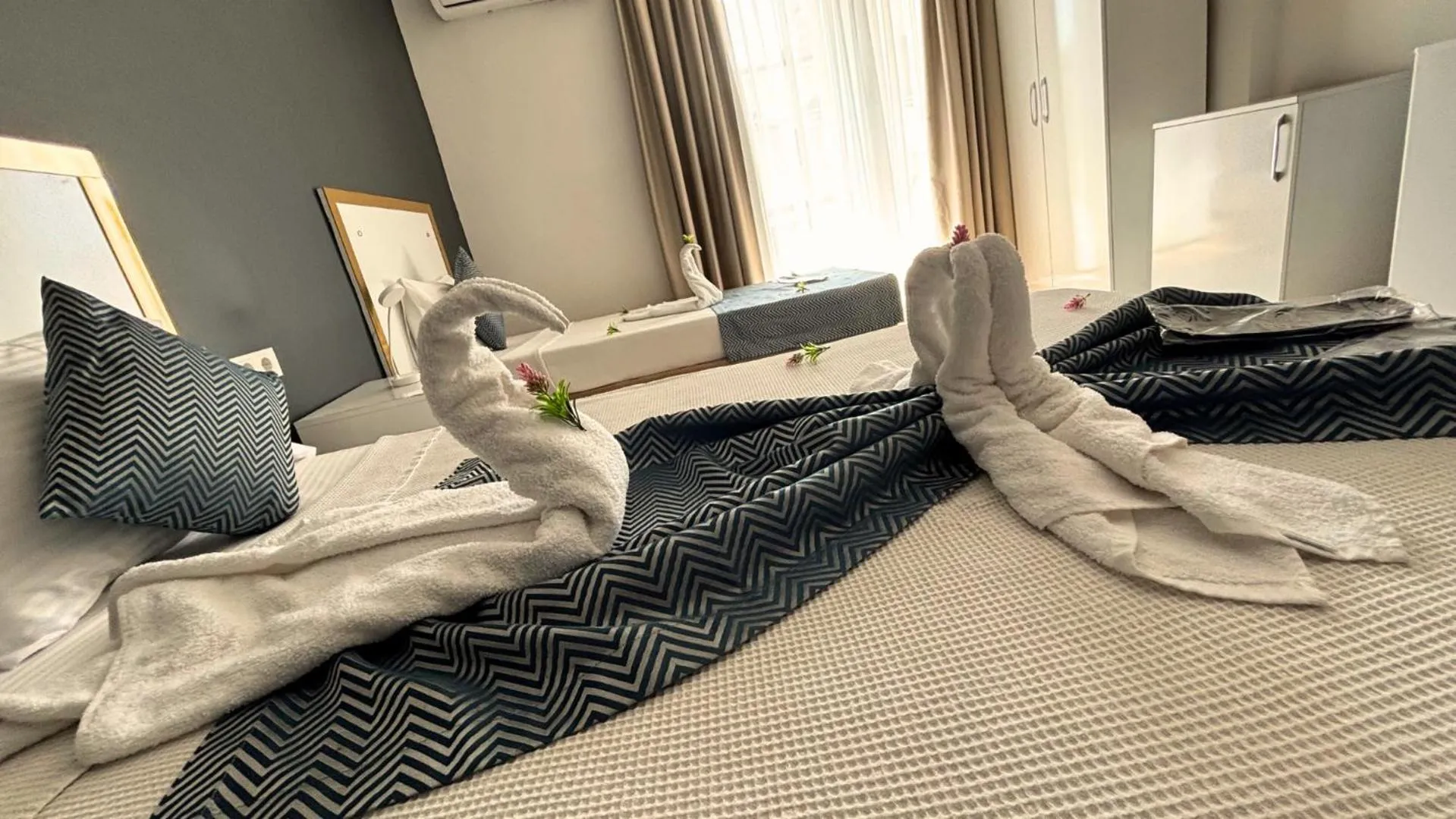 Bed in MOONBOW BEACH HOTEL