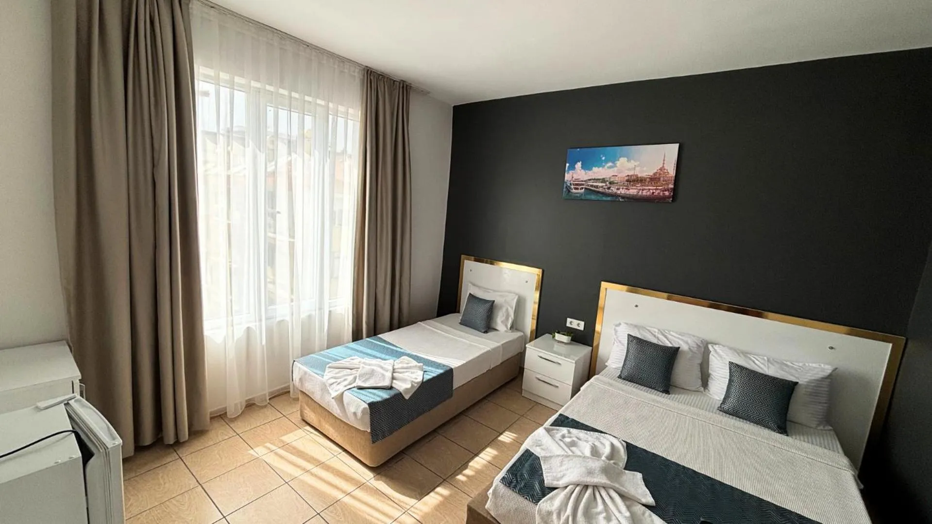 Bed in MOONBOW BEACH HOTEL