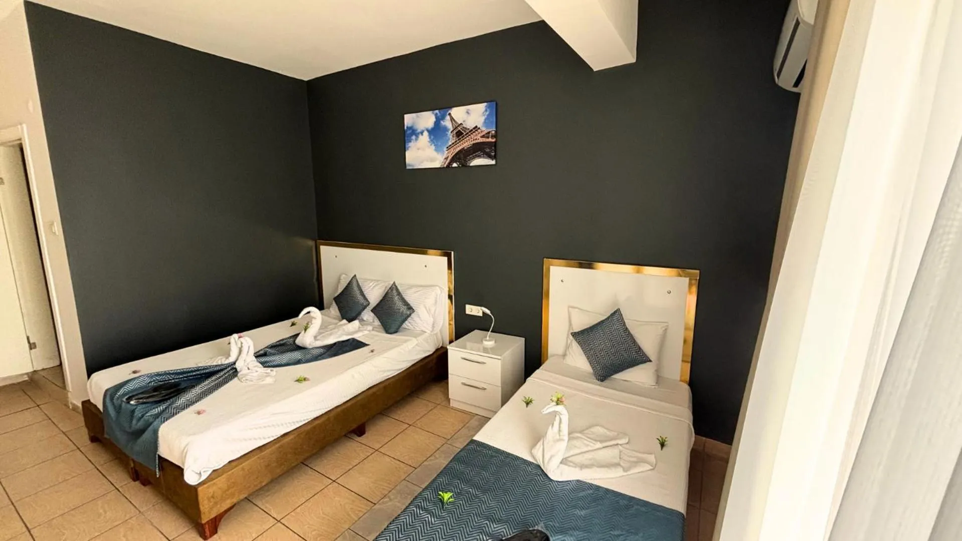 Bed in MOONBOW BEACH HOTEL