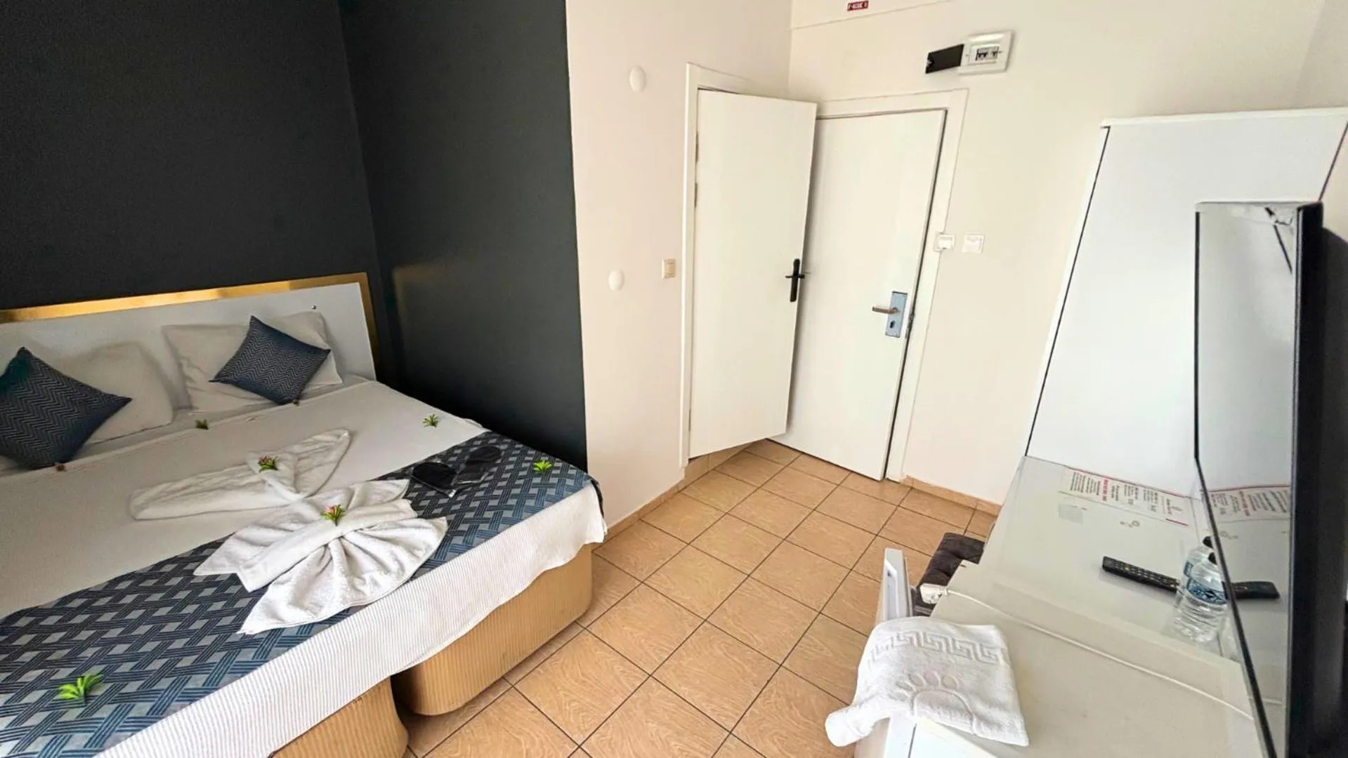 Bed in MOONBOW BEACH HOTEL