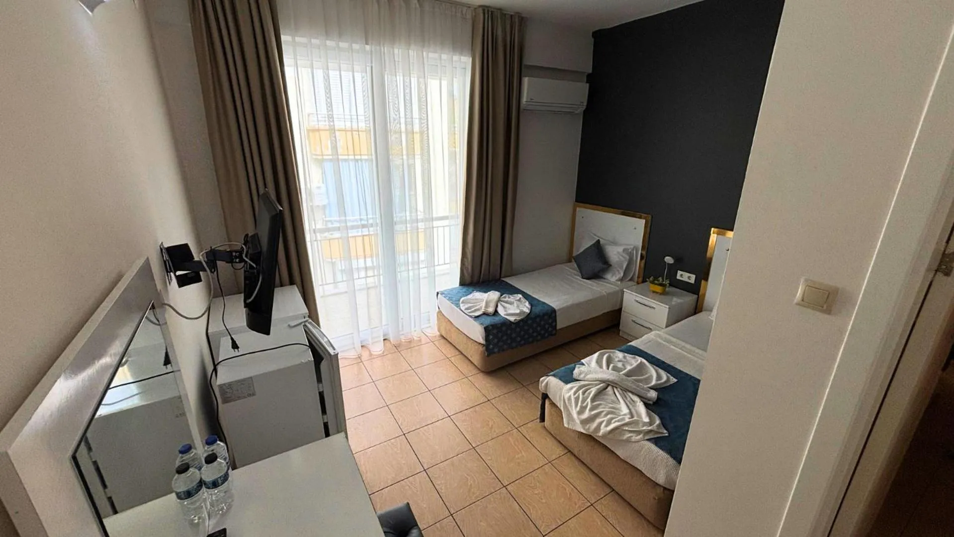 Bed in MOONBOW BEACH HOTEL