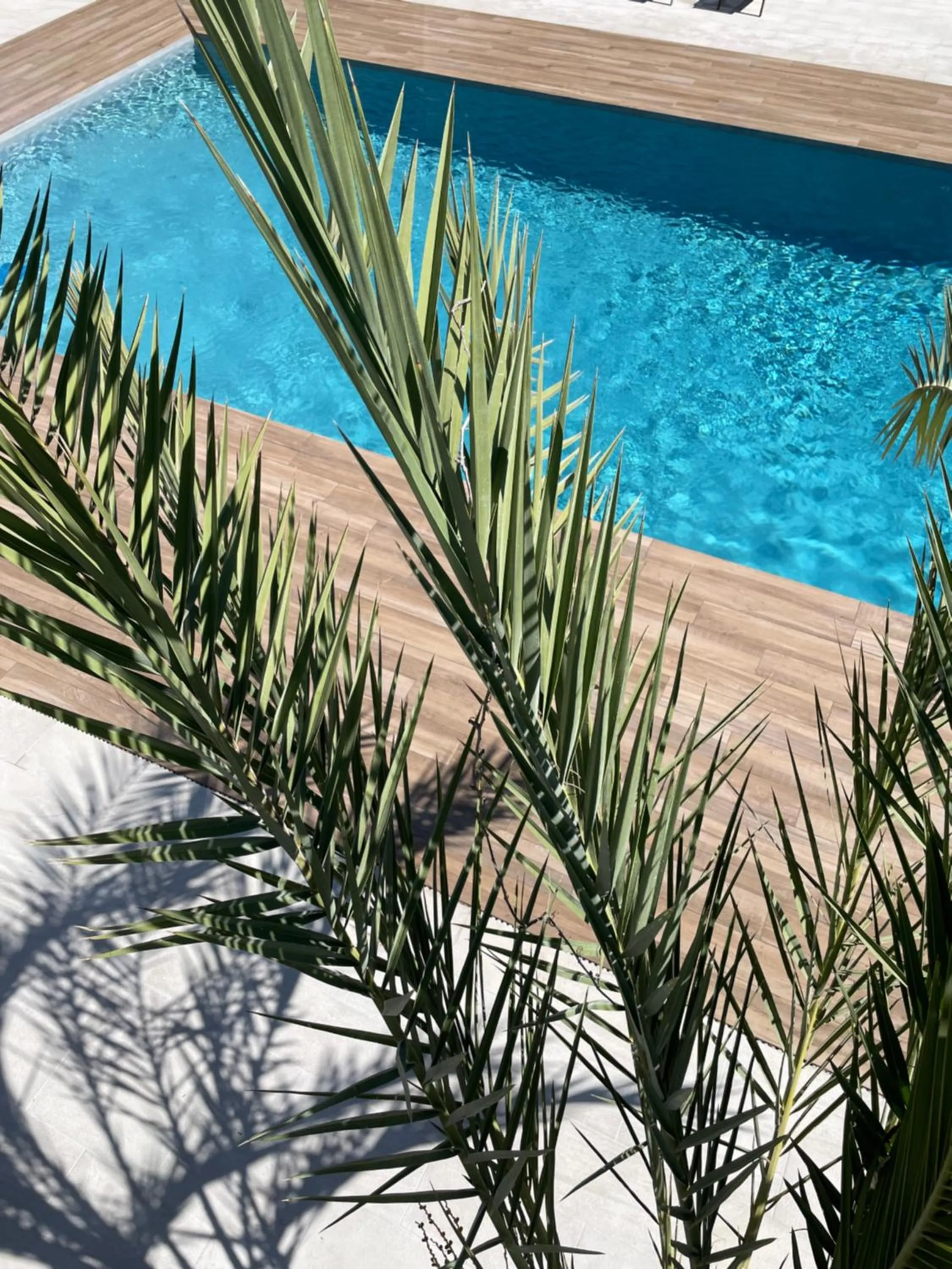 Swimming pool in Le Confidentiel Hôtel & SPA