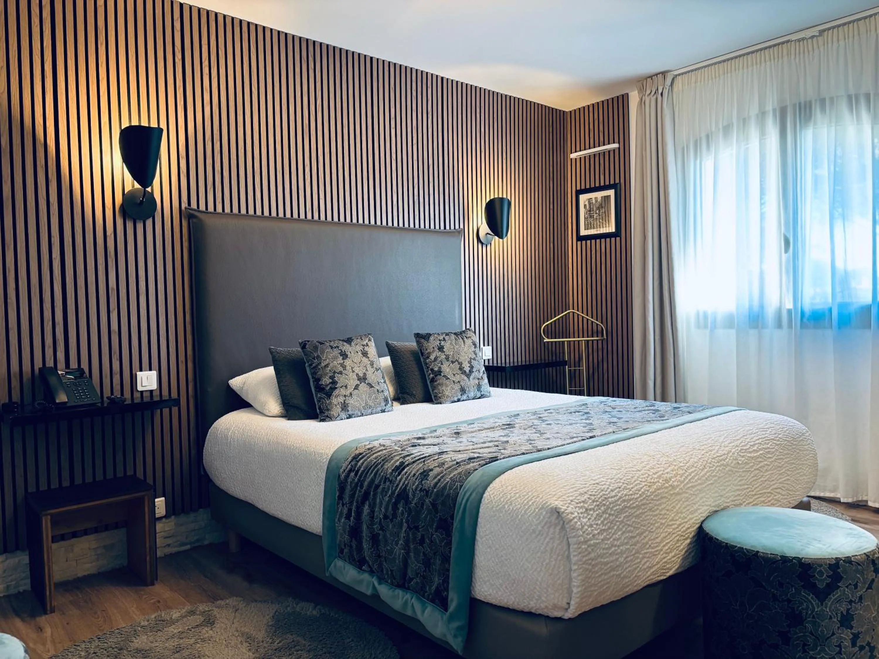 Bed in Le Confidentiel Hôtel & SPA