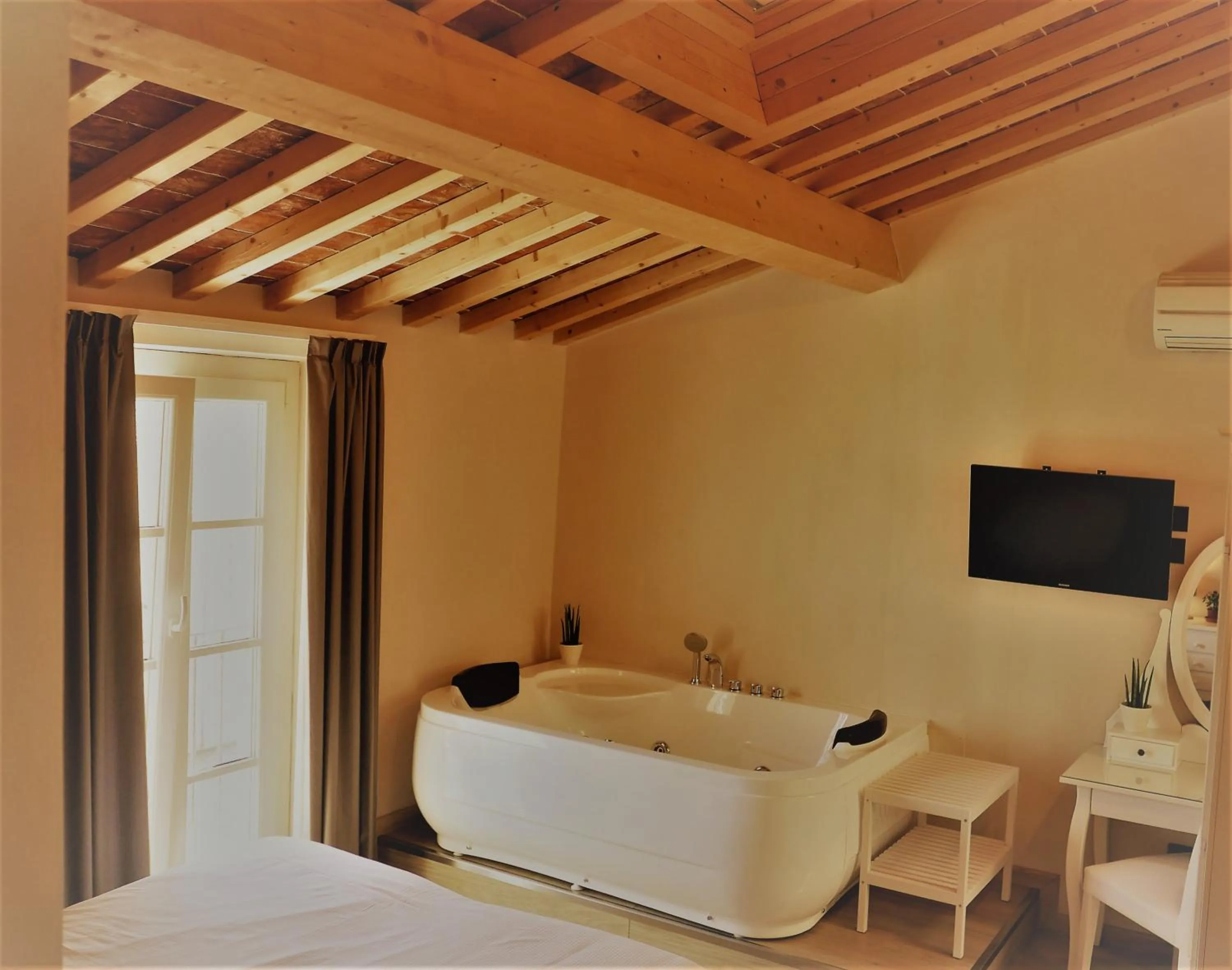Bed in Il Tiglio Jacuzzi&Sauna