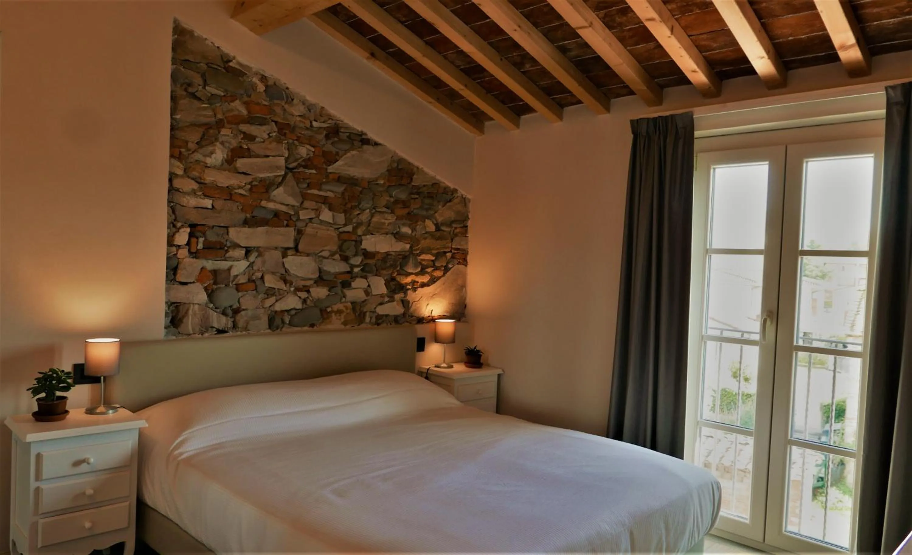 Bed in Il Tiglio Jacuzzi&Sauna