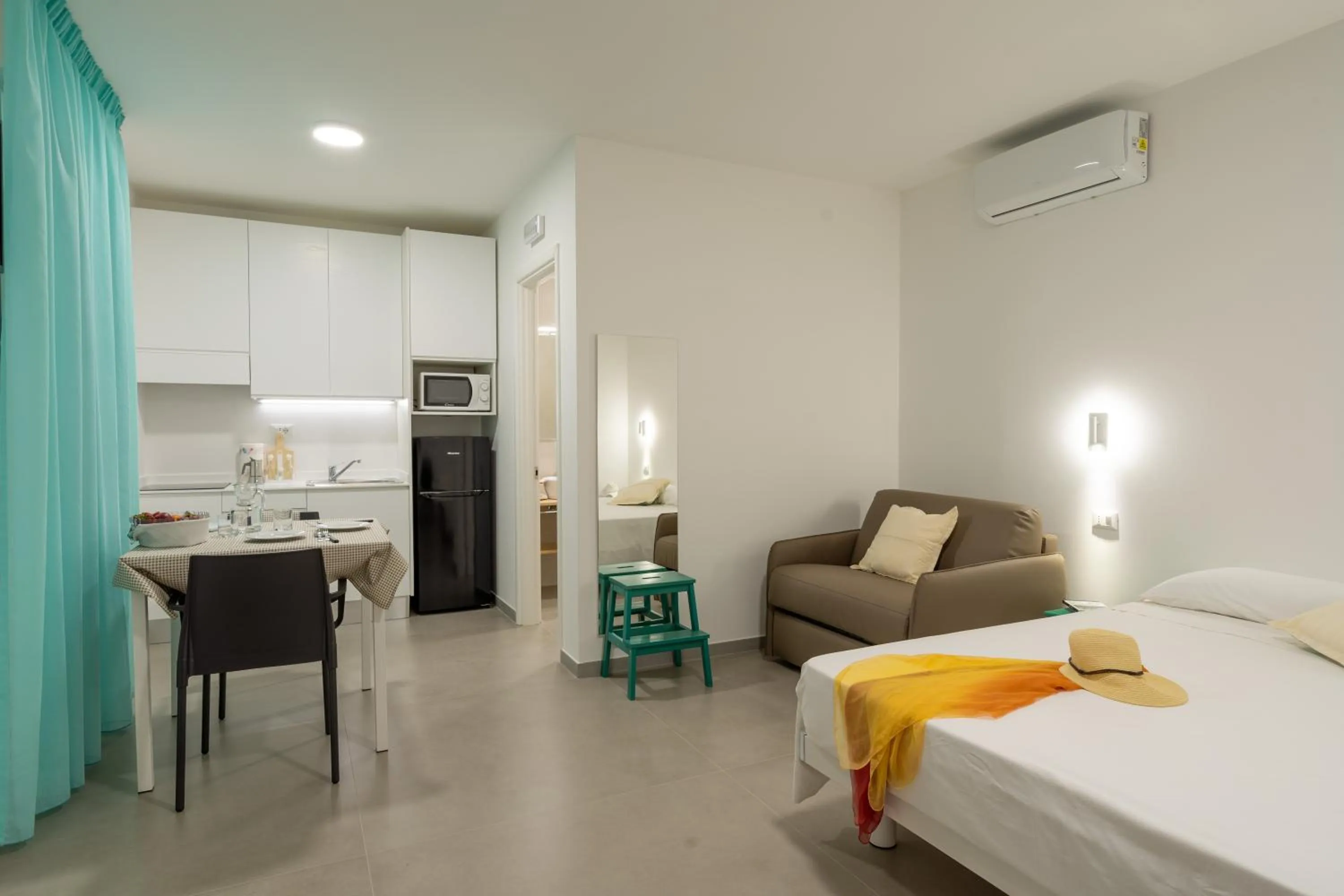 Bed in SMERALDO RESIDENCE