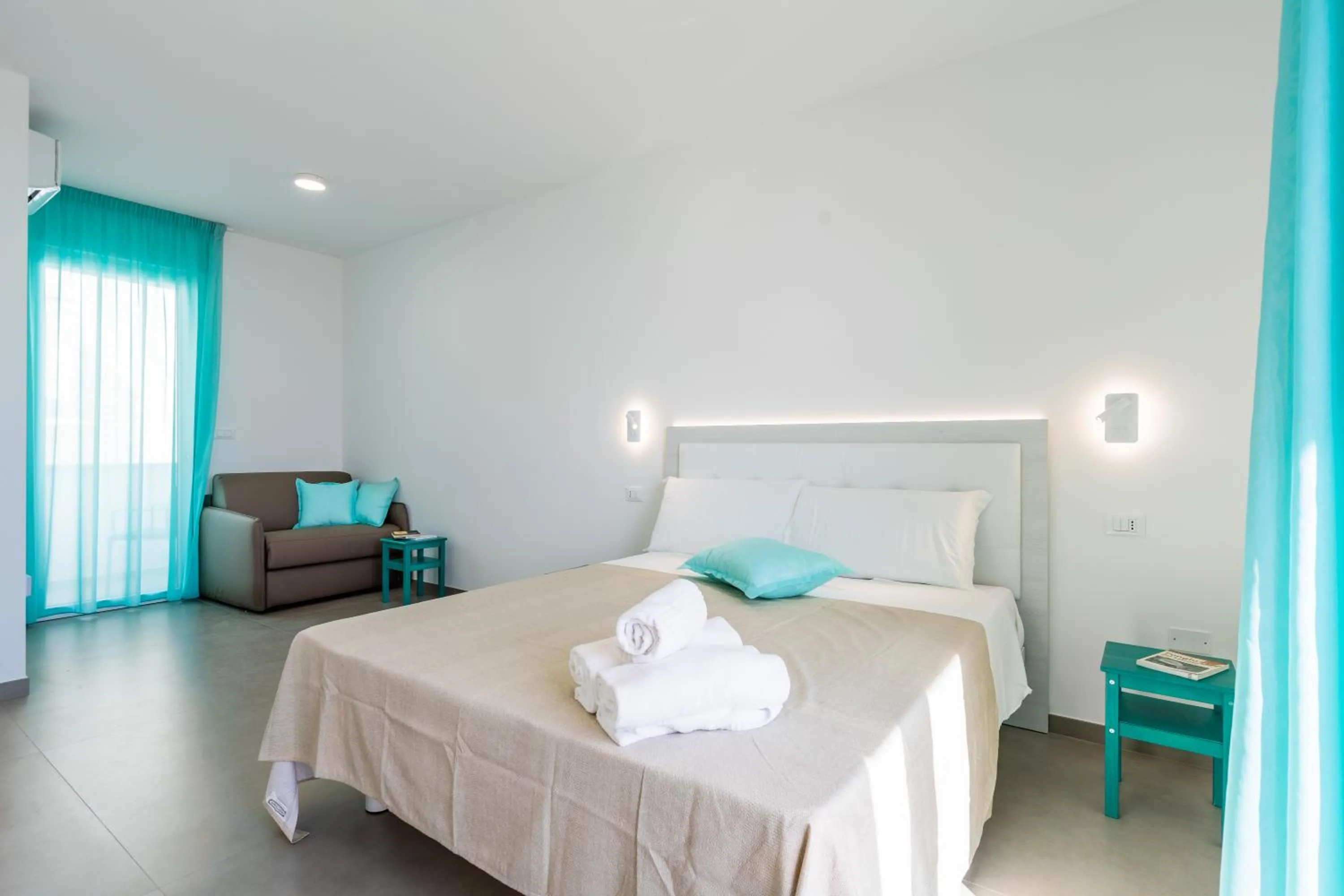 Bed in SMERALDO RESIDENCE