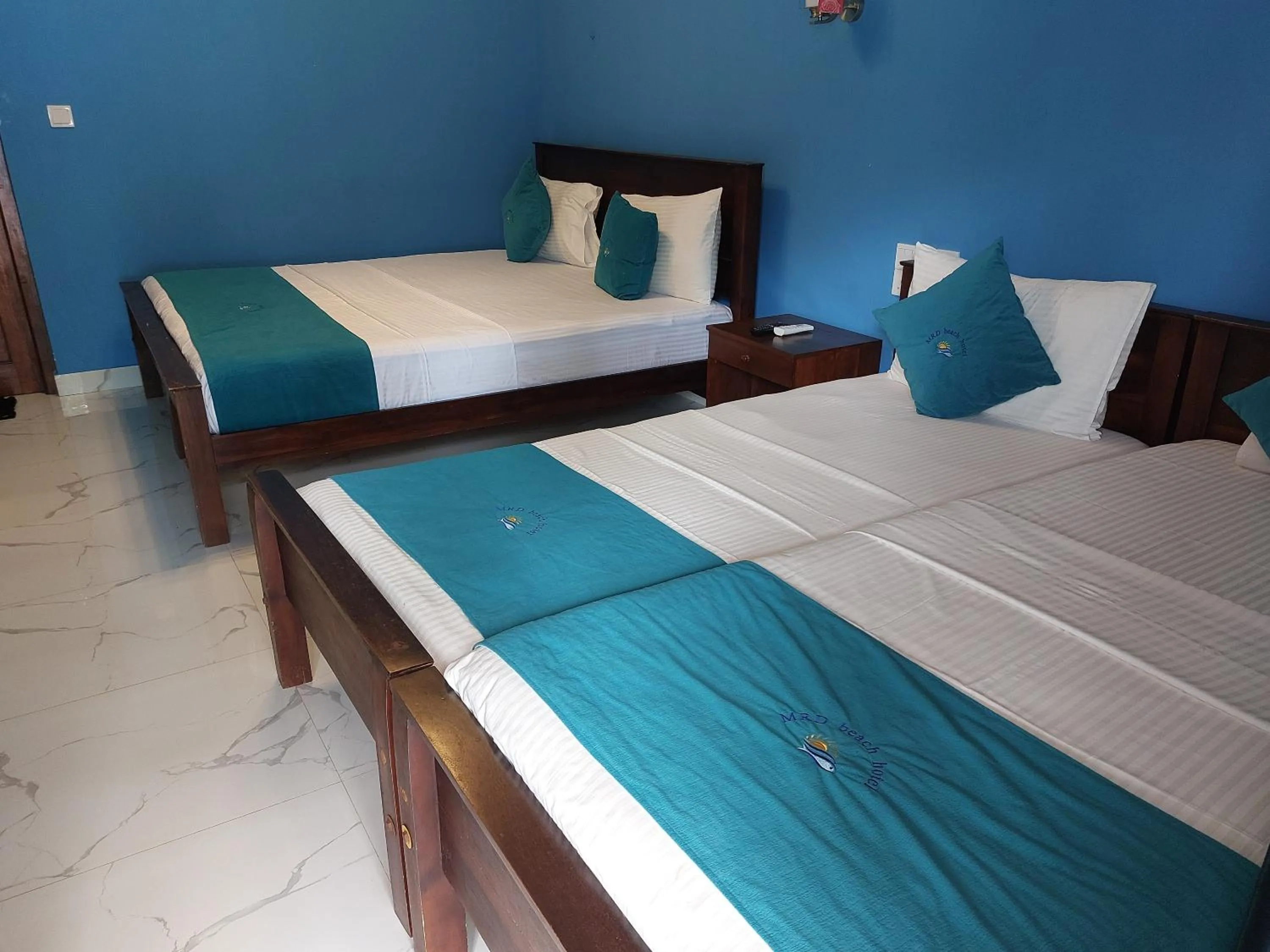 Bed in MRD Beach Hotel