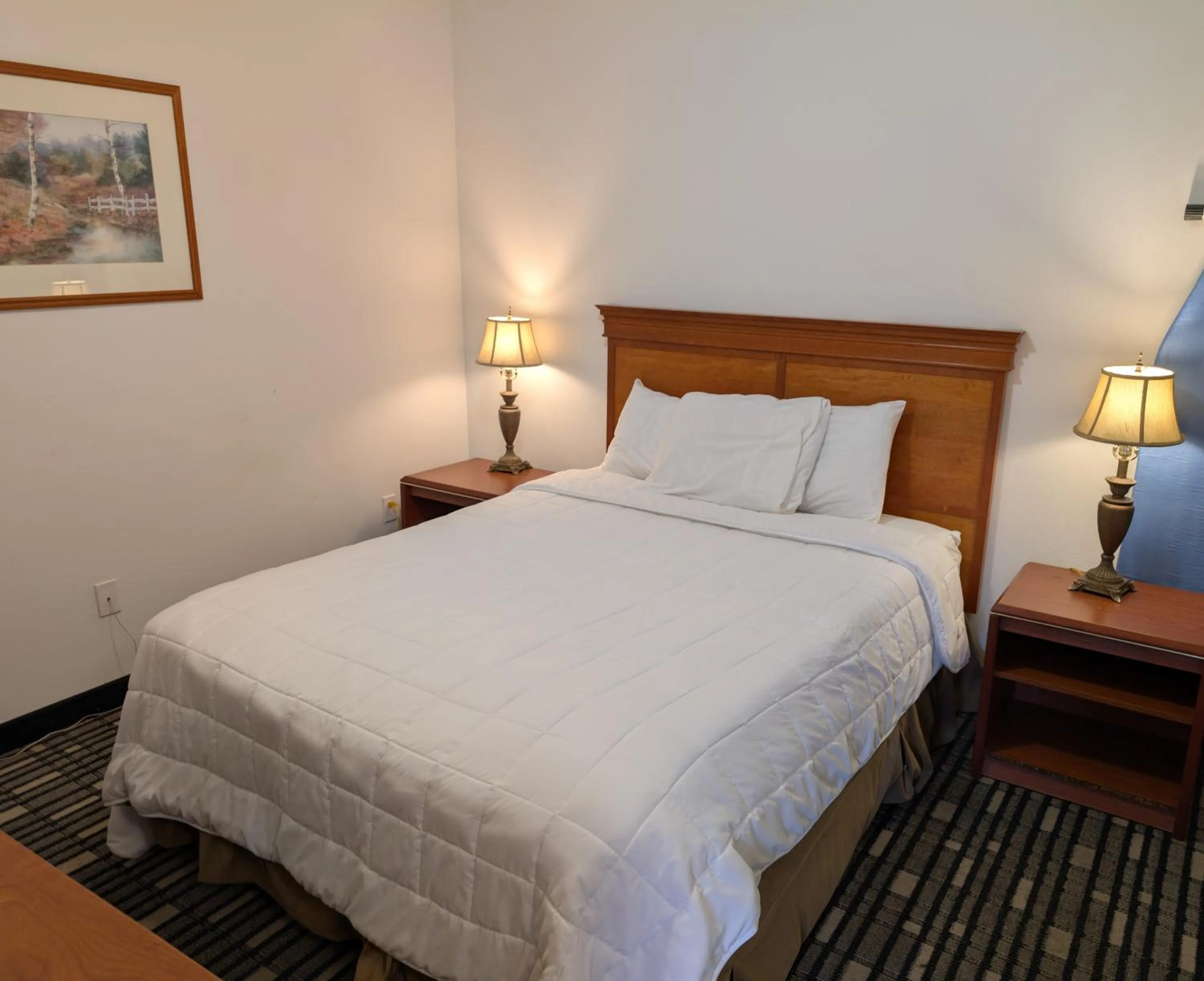 Bed in Ponderosa Motel