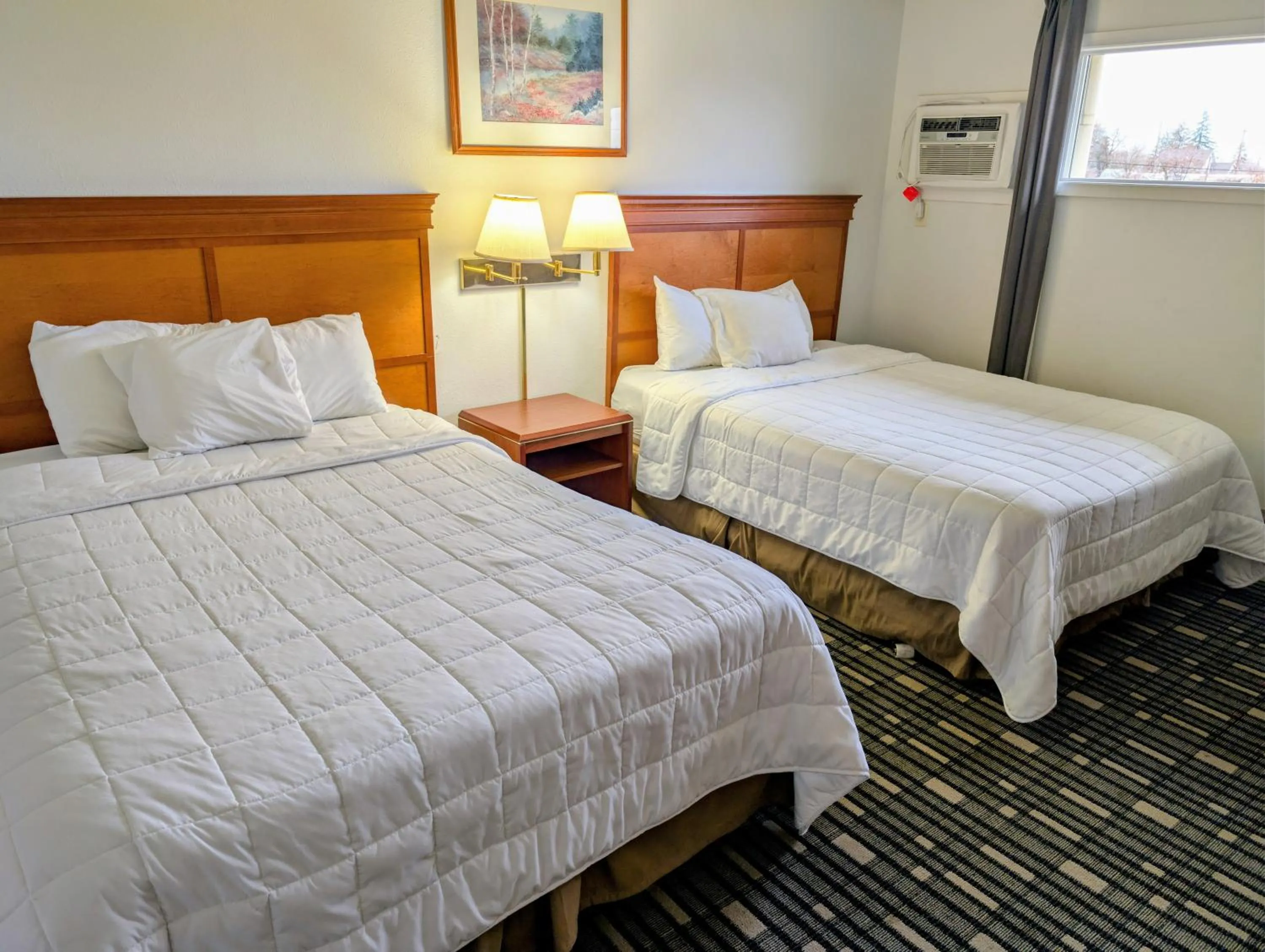 Bed in Ponderosa Motel