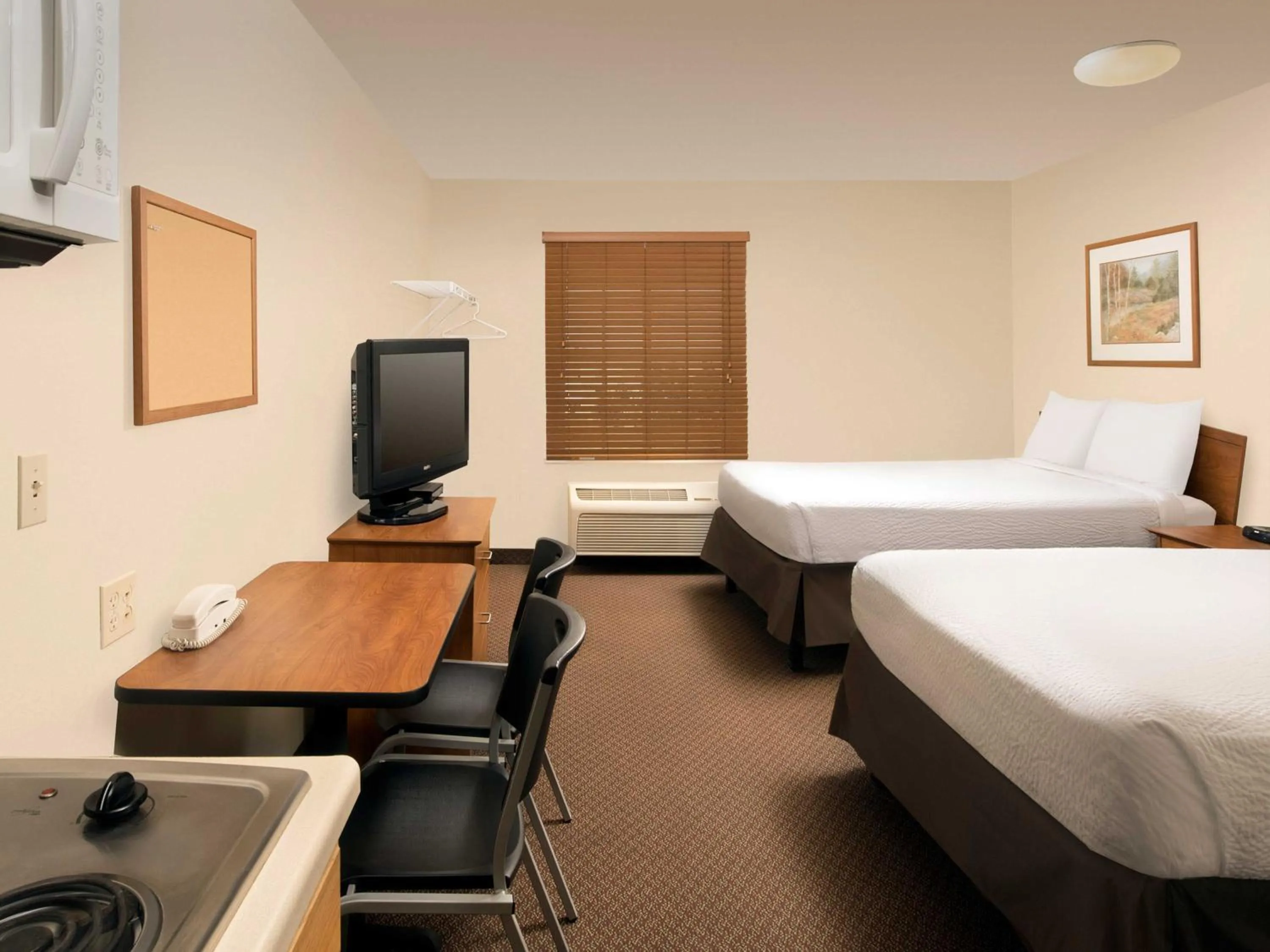 Photo of the whole room, Bed in WoodSpring Suites Midland