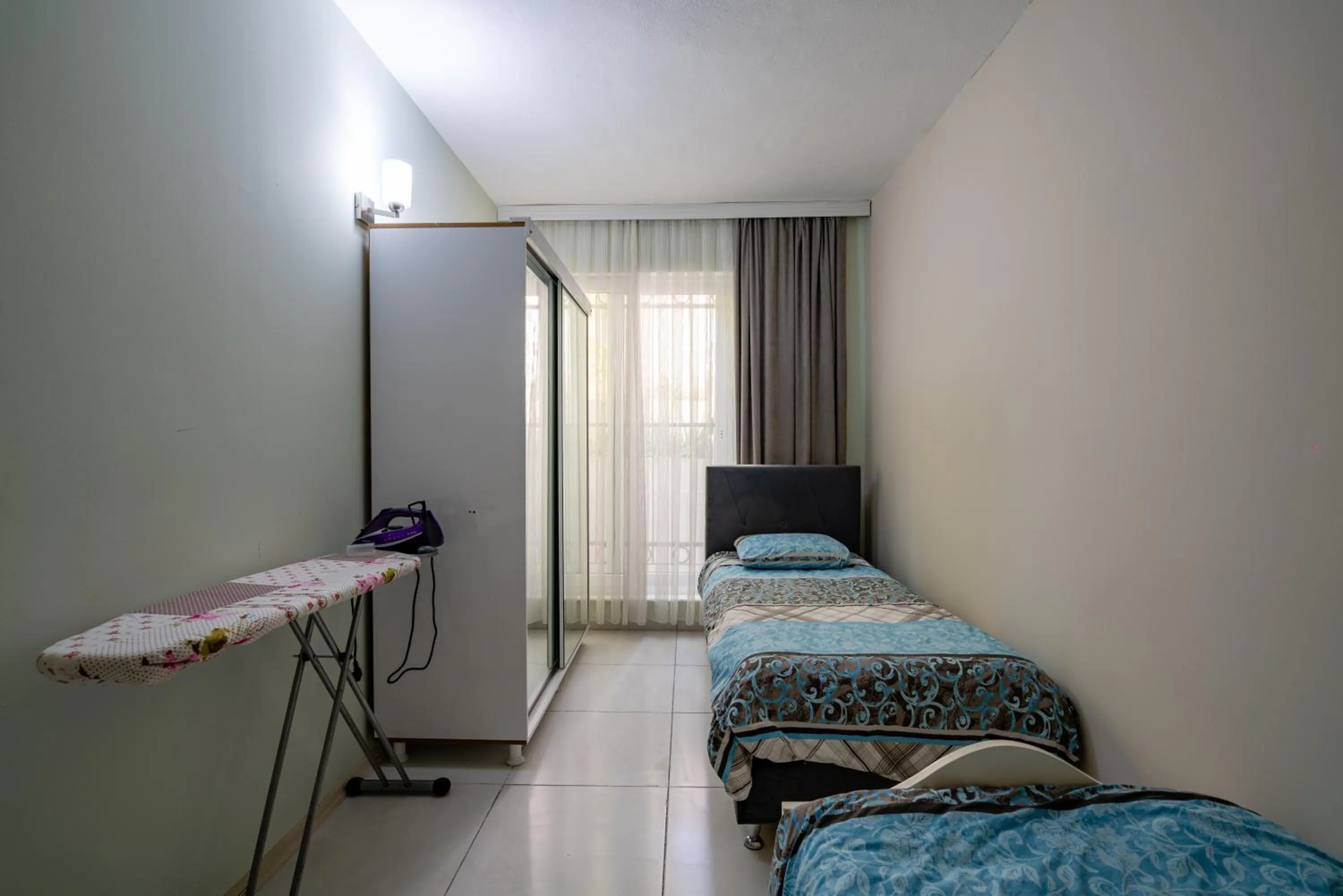 Bed in Sare Suites Downtown