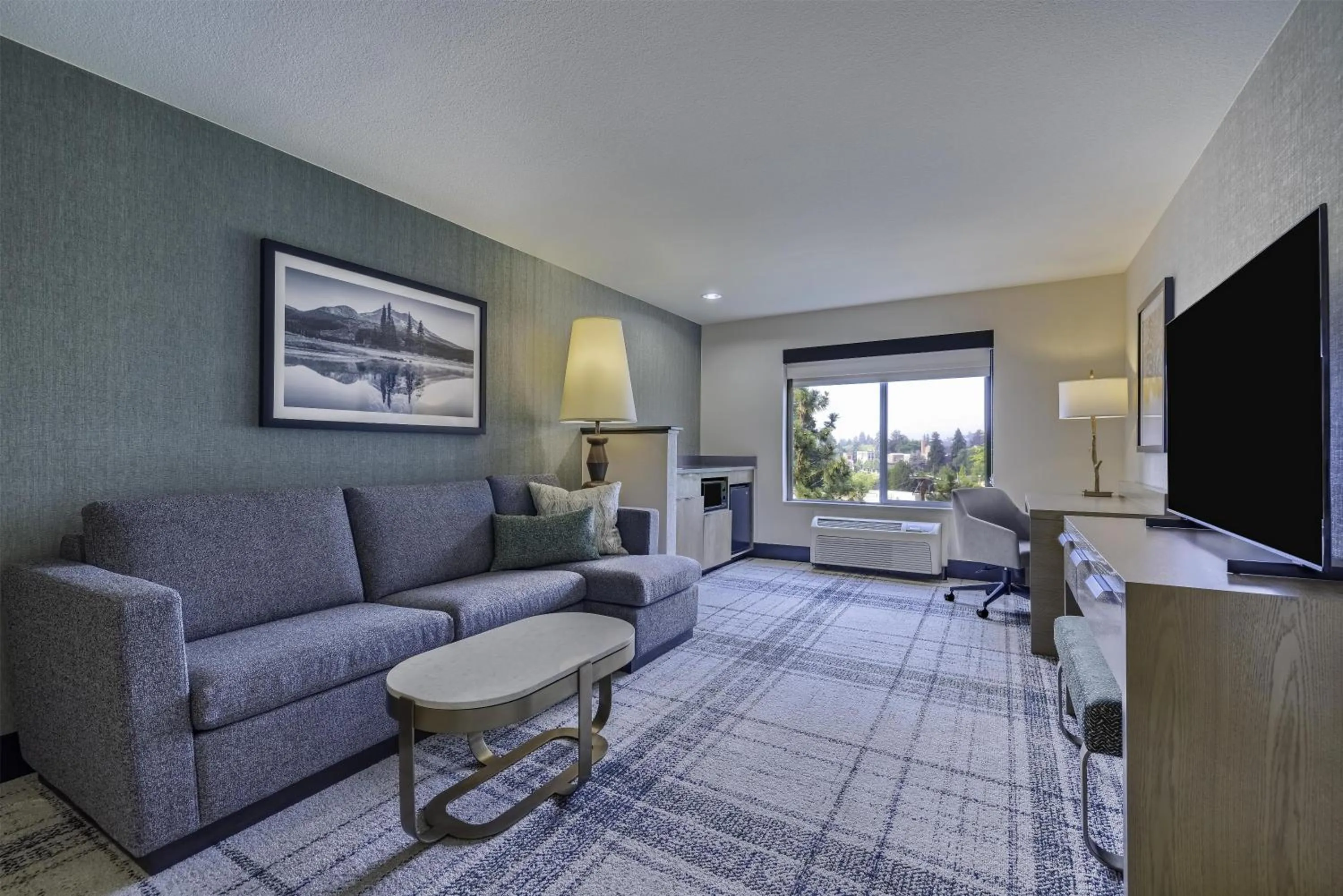 Living room in The Newberry Hotel Bend, Tapestry Collection by Hilton