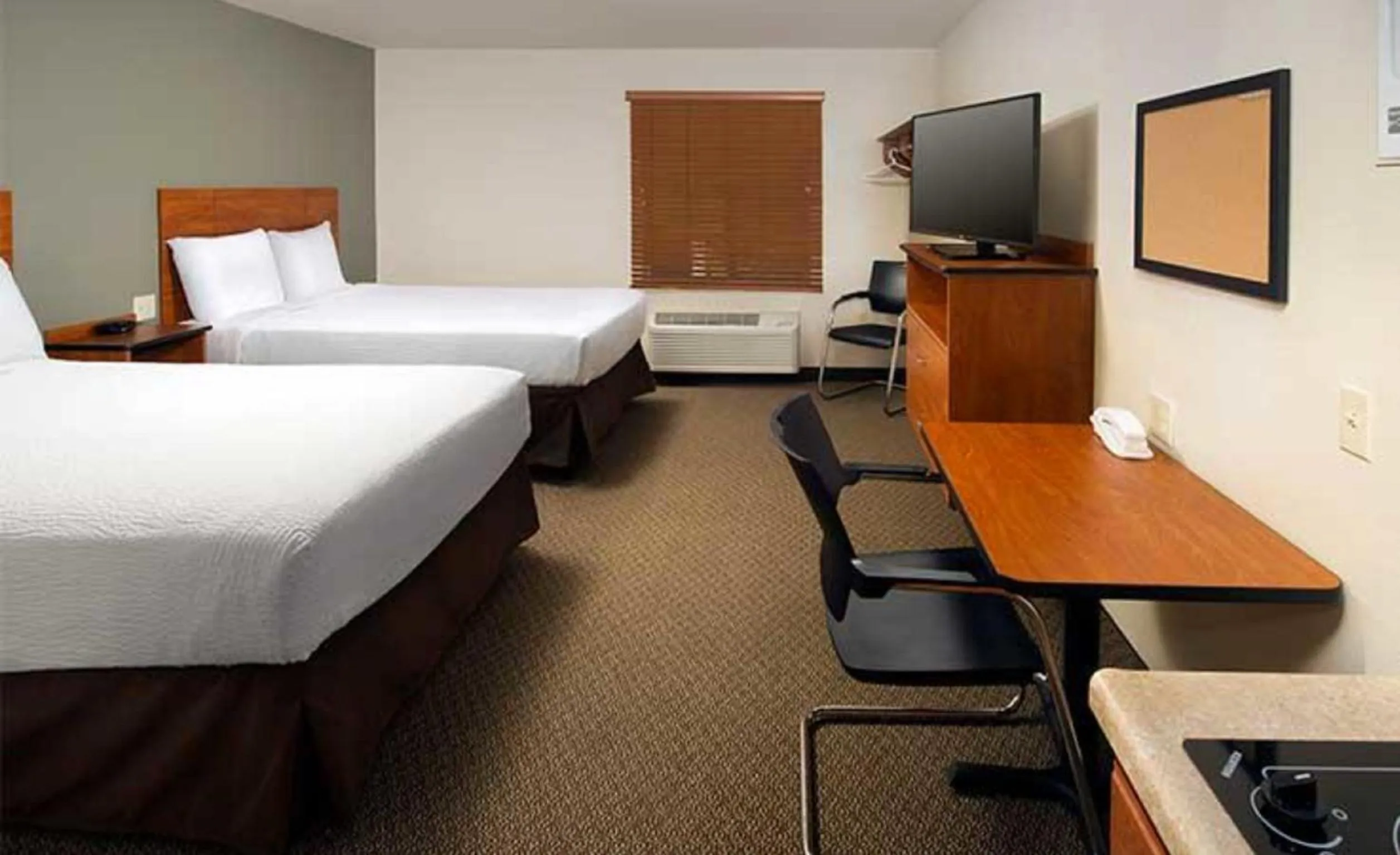 Photo of the whole room, Bed in WoodSpring Suites Dallas Rockwall