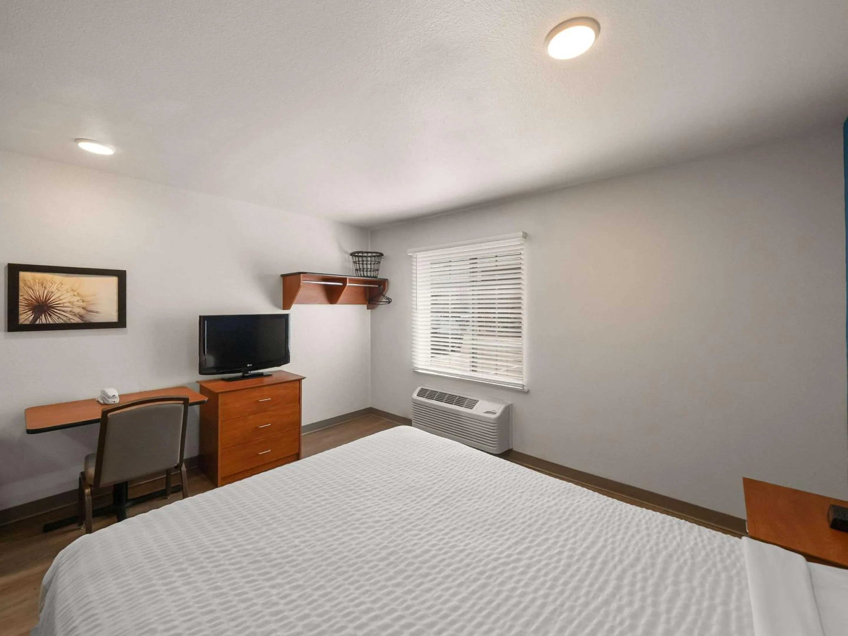 Bedroom, Bed in WoodSpring Suites Dallas Rockwall