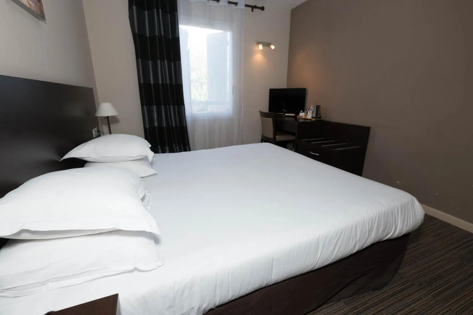 Bed in SOWELL HOTELS Domaine de la Petite Isle