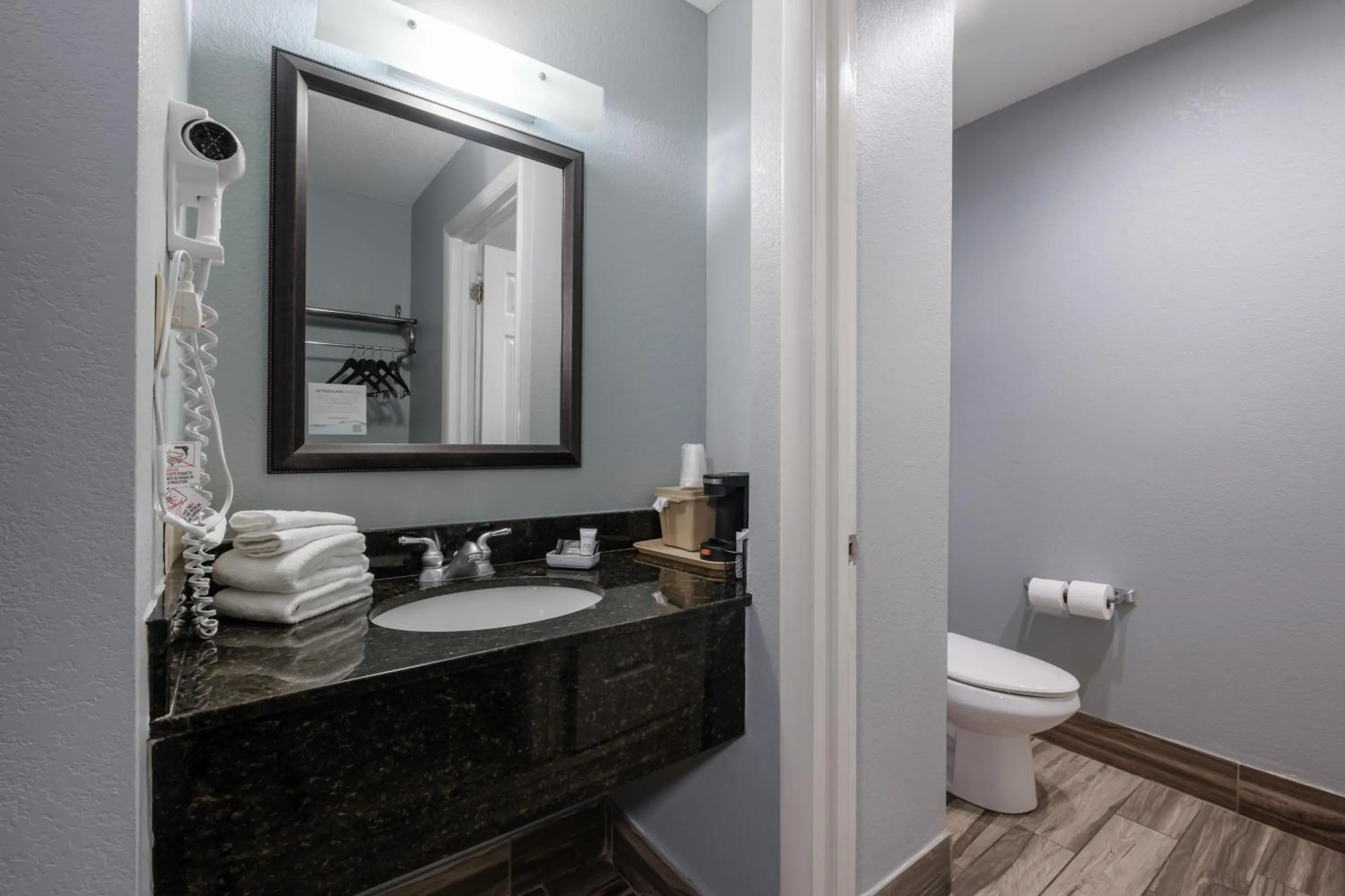 Toilet in Baymont by Wyndham Louisville Airport South