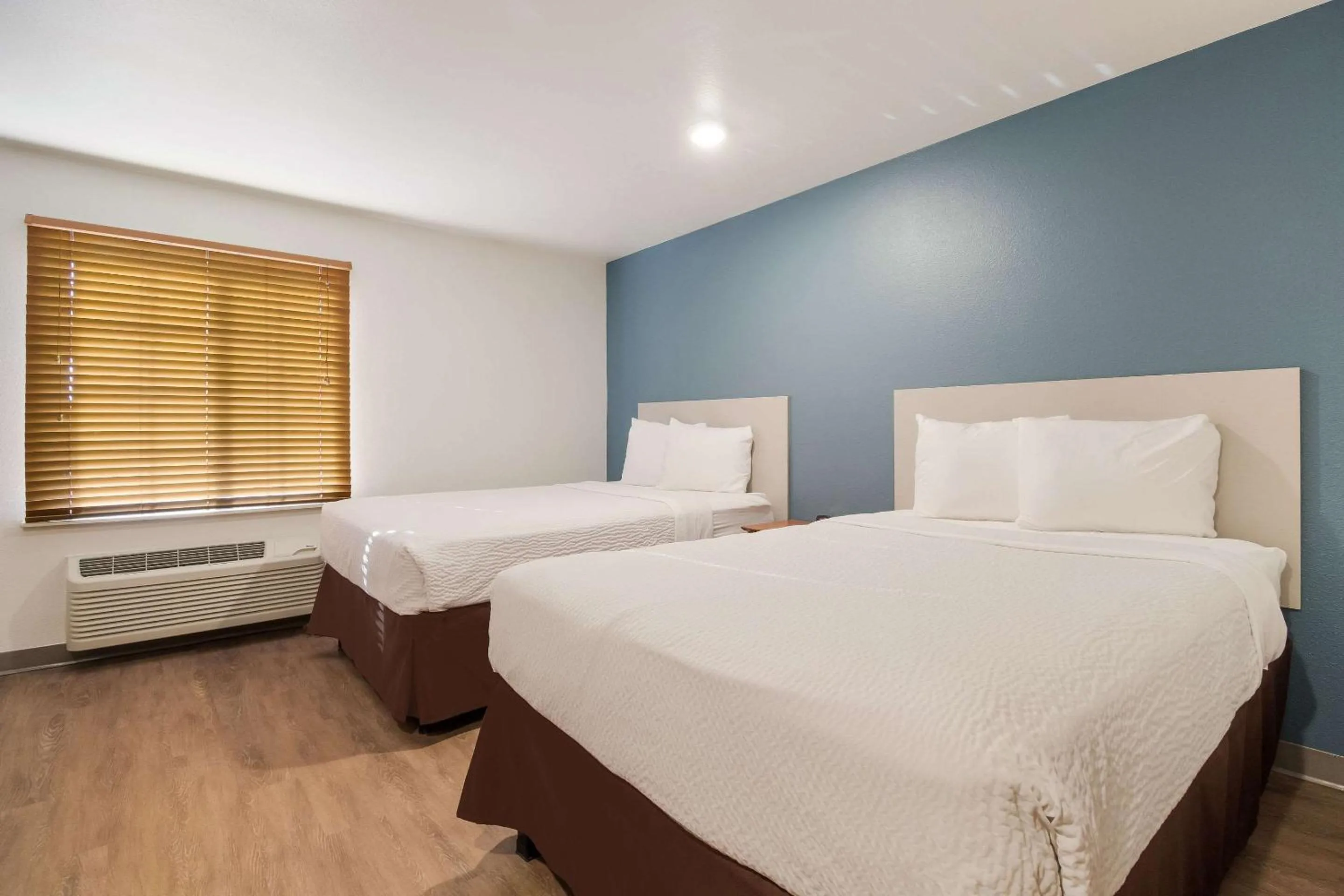 Photo of the whole room, Bed in WoodSpring Suites Houston I-45 Airtex