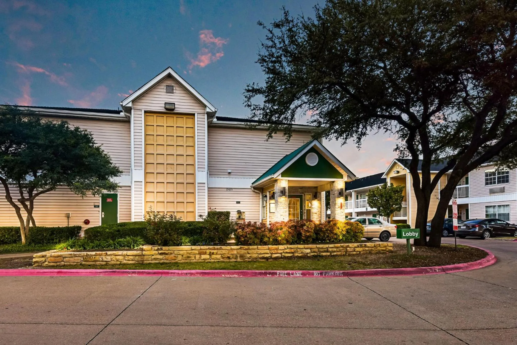 Property building in HomeTowne Studios by Red Roof Dallas - North Addison - Tollway