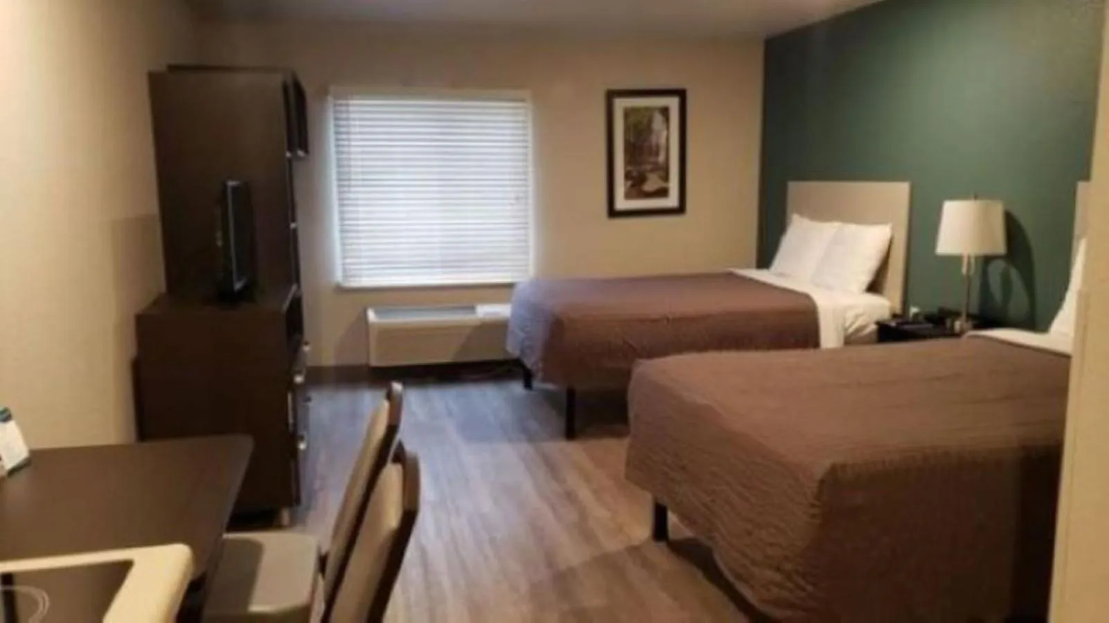 Bed in WoodSpring Suites Charlotte Gastonia