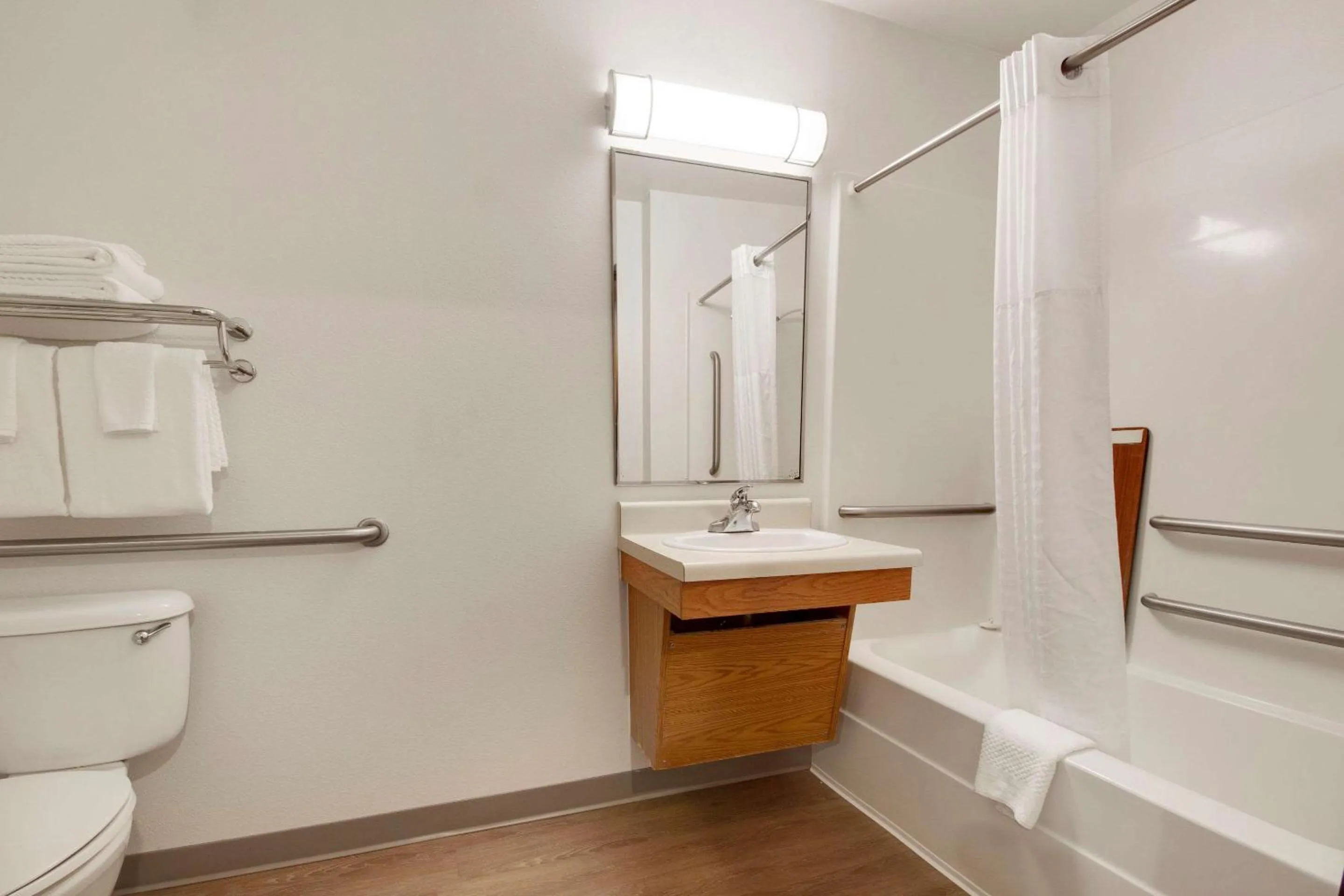 Bathroom in WoodSpring Suites Conroe