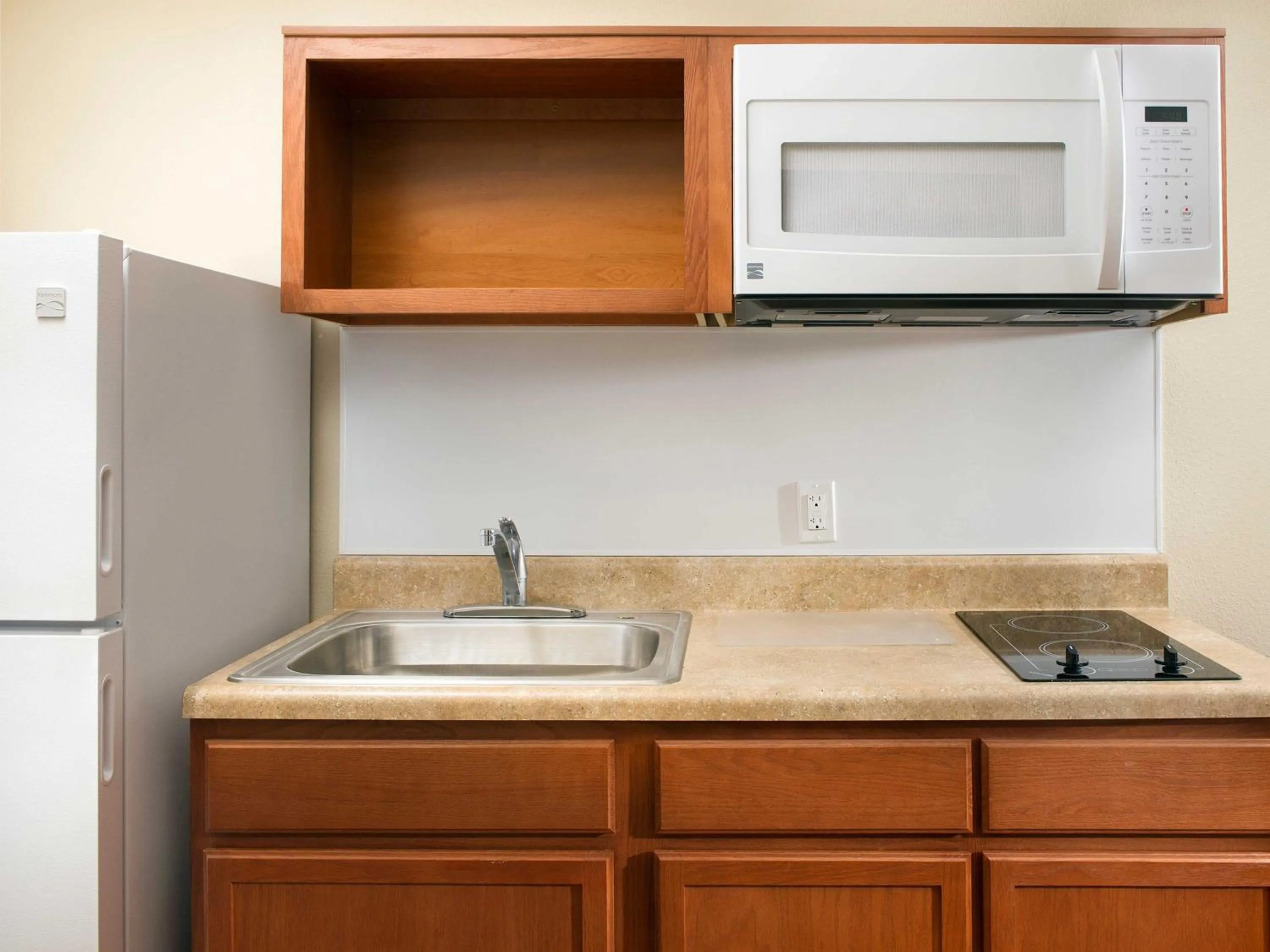 Kitchen or kitchenette in WoodSpring Suites Omaha Bellevue, an Extended Stay Hotel