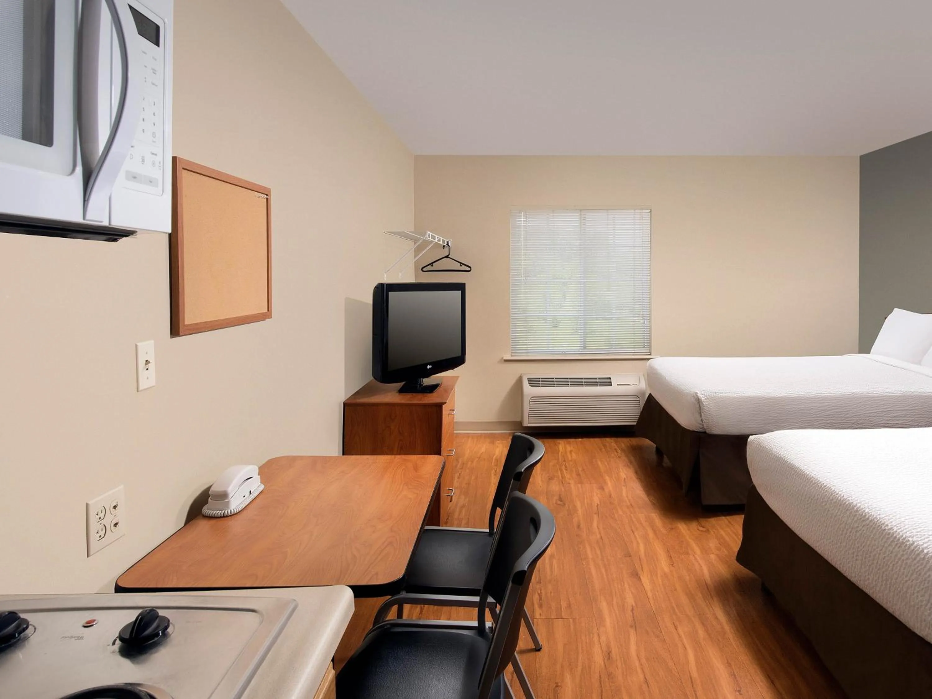 Photo of the whole room, Bed in WoodSpring Suites Council Bluffs