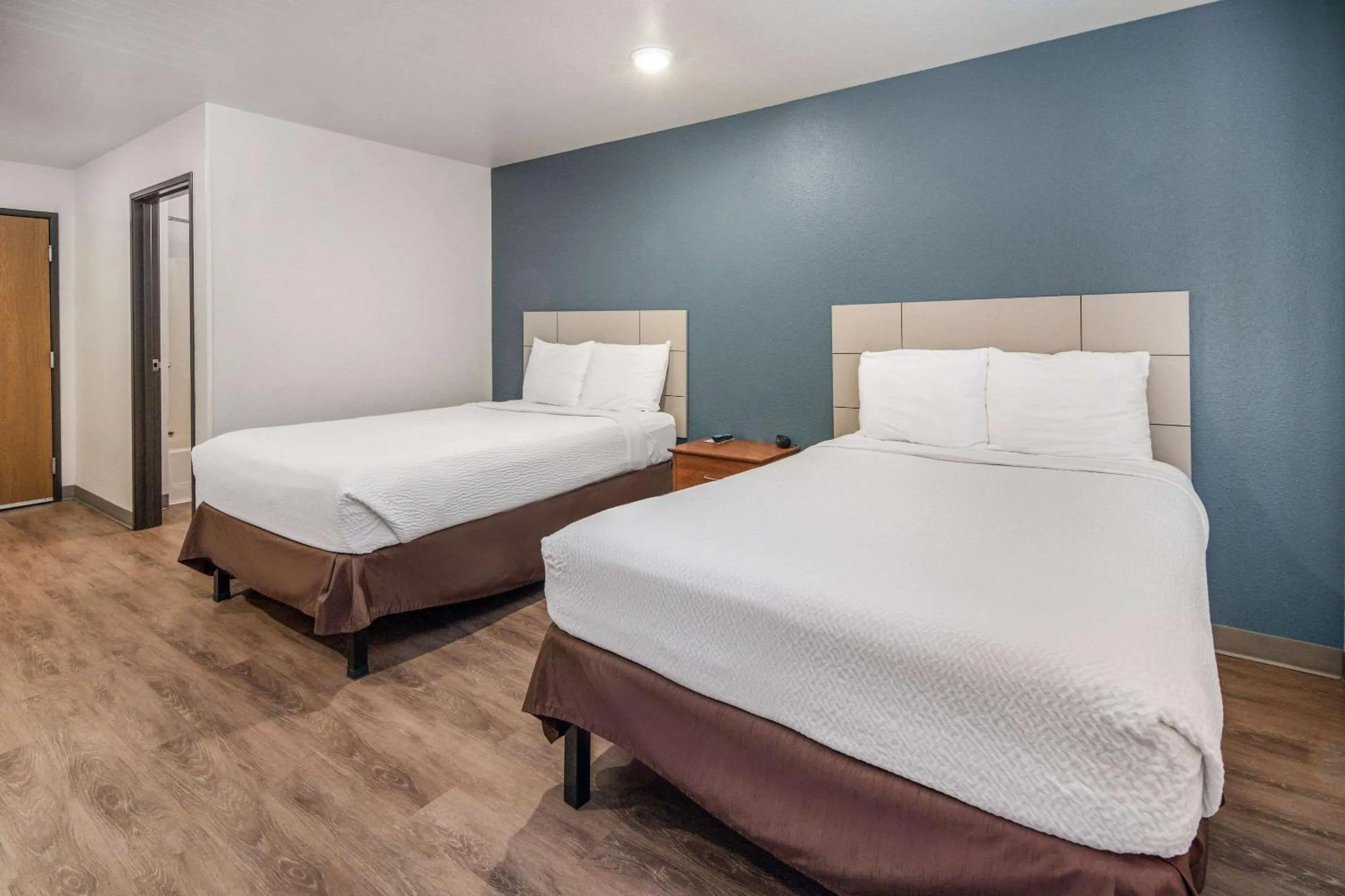 Photo of the whole room, Bed in WoodSpring Suites Denton