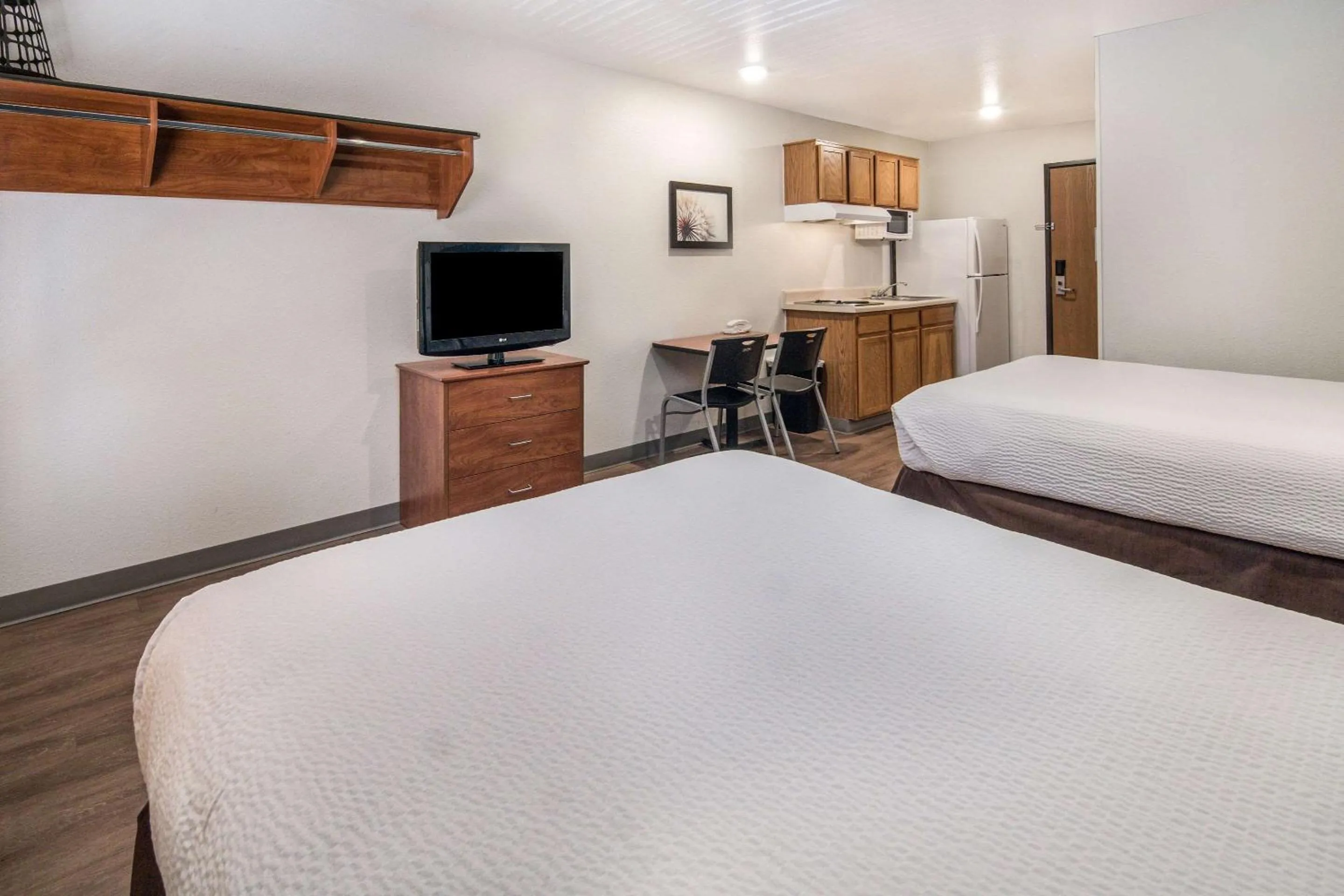 Photo of the whole room, Bed in WoodSpring Suites Denton
