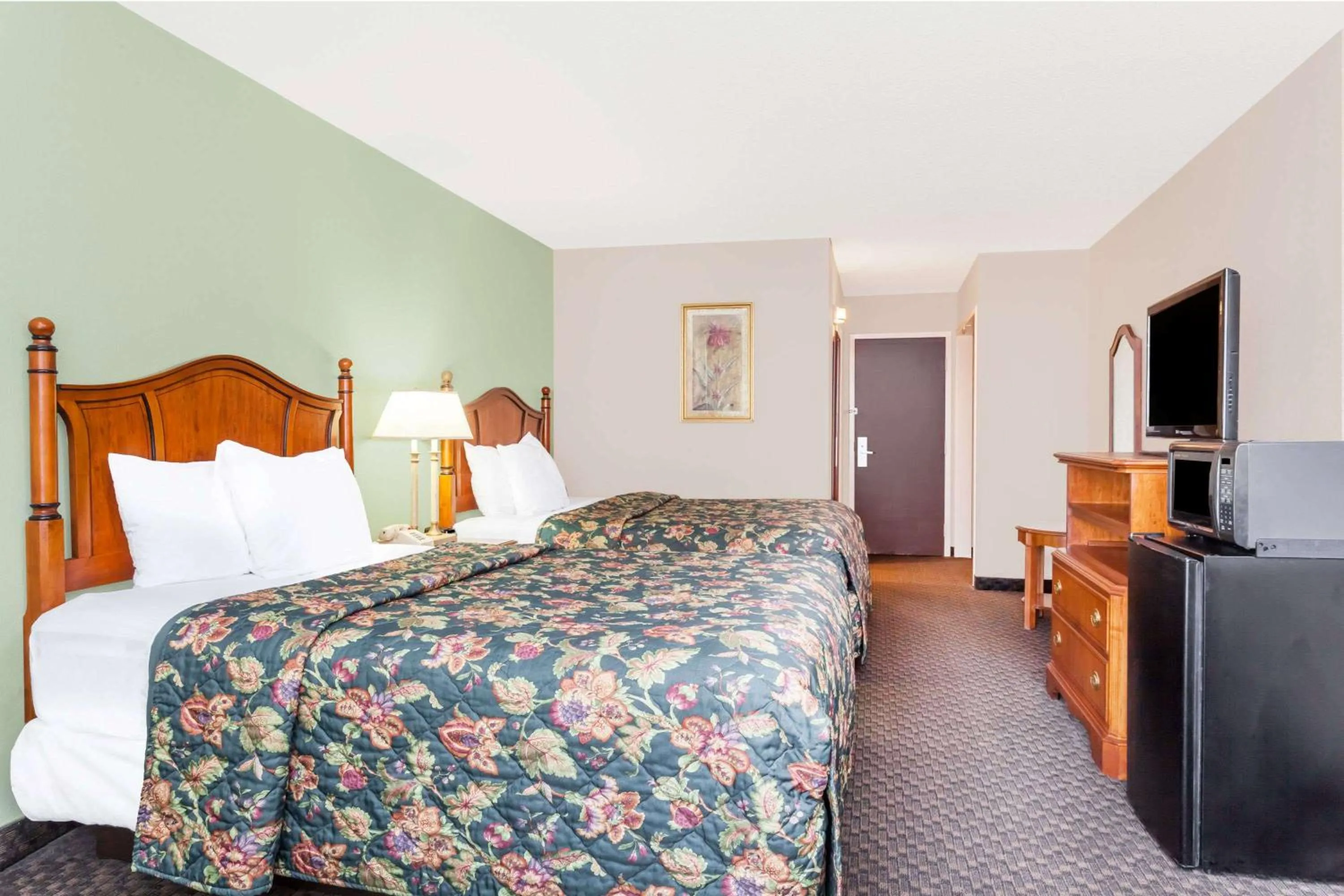 Photo of the whole room in Days Inn & Suites by Wyndham SE Columbia Ft Jackson