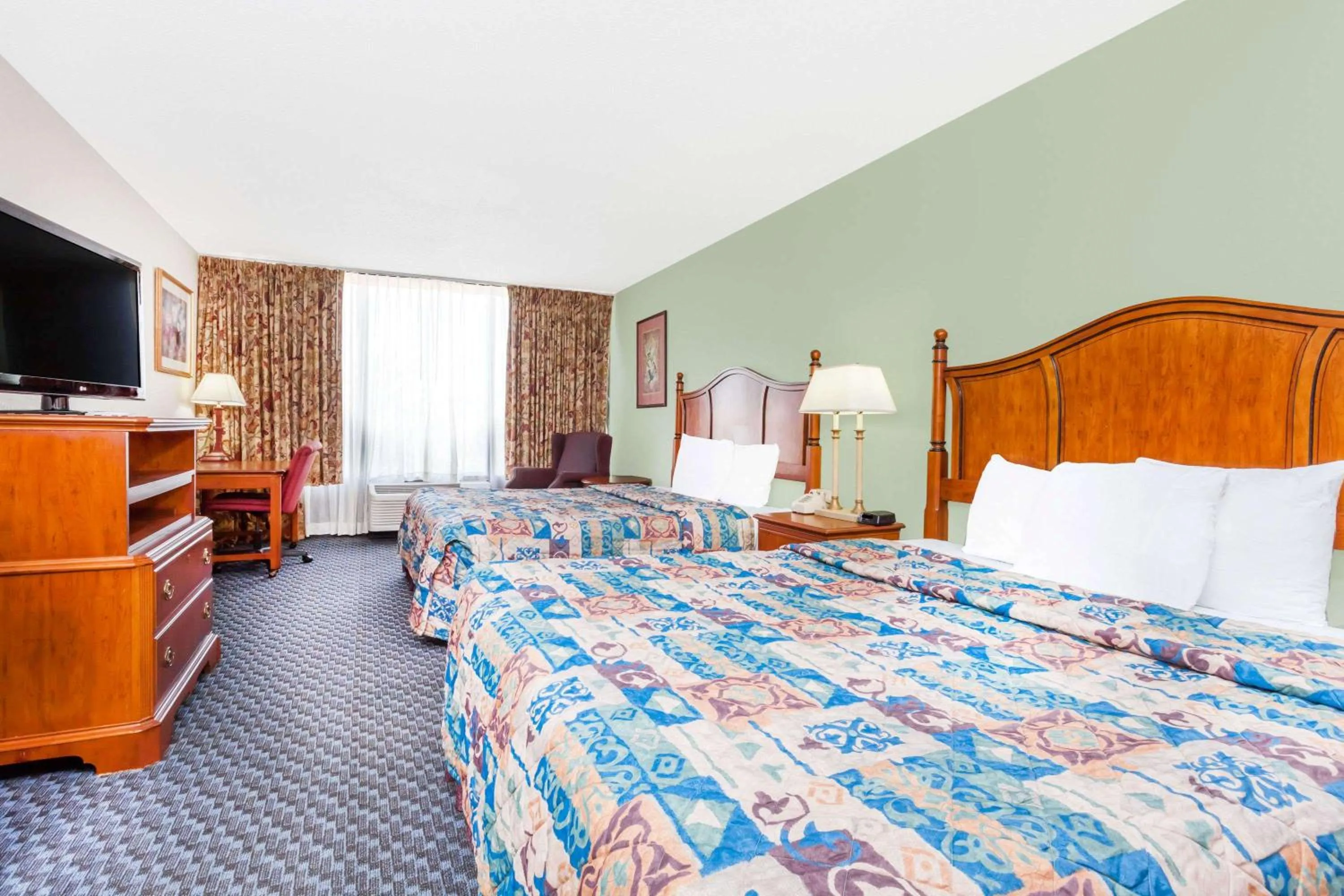 Photo of the whole room in Days Inn & Suites by Wyndham SE Columbia Ft Jackson