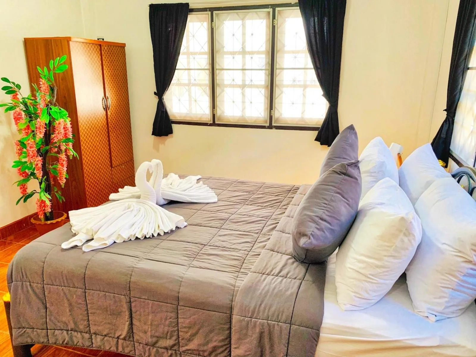 Bed in Thai Orange Villas