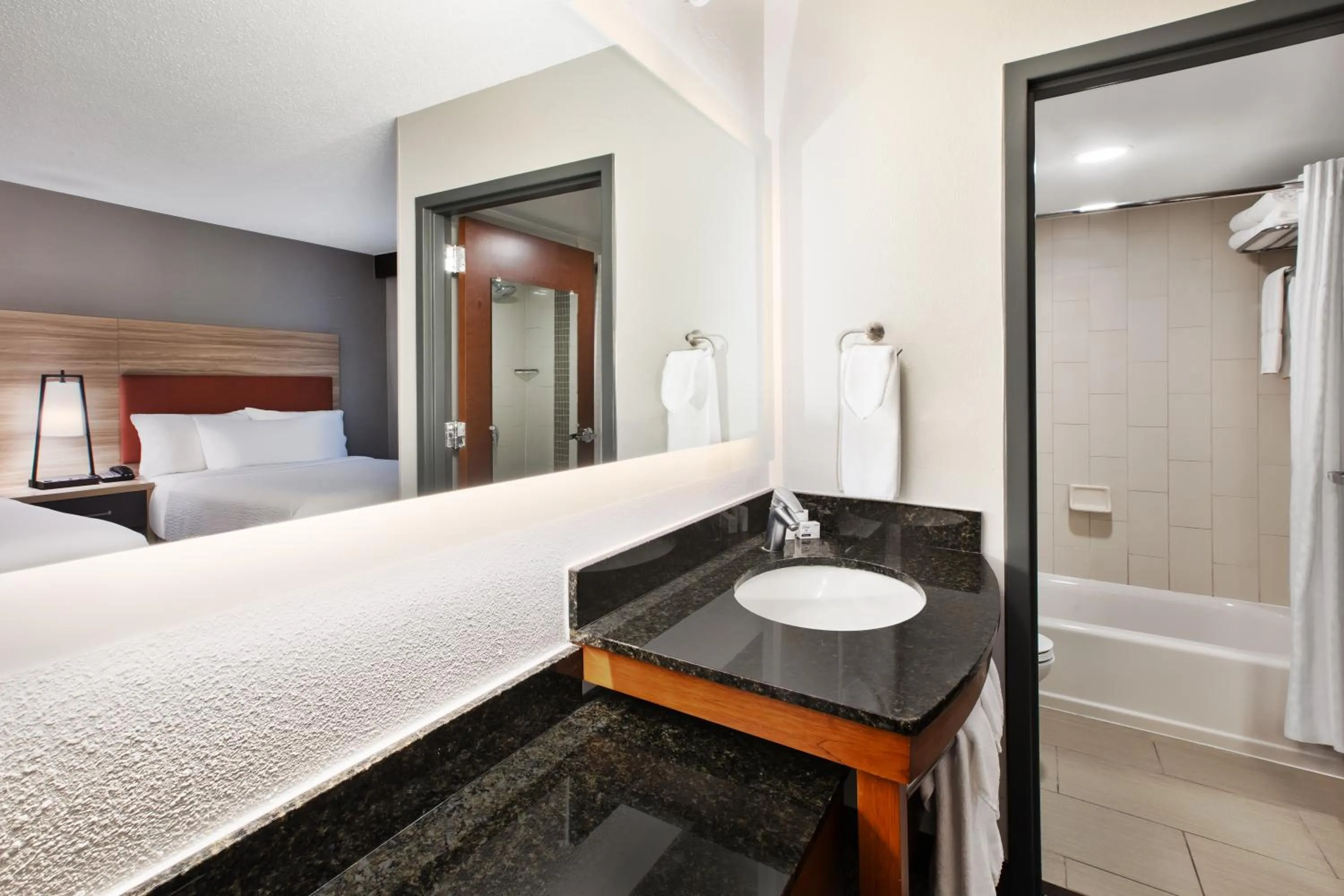 Bathroom, Bed in Candlewood Suites - Cincinnati Northeast - Mason by IHG