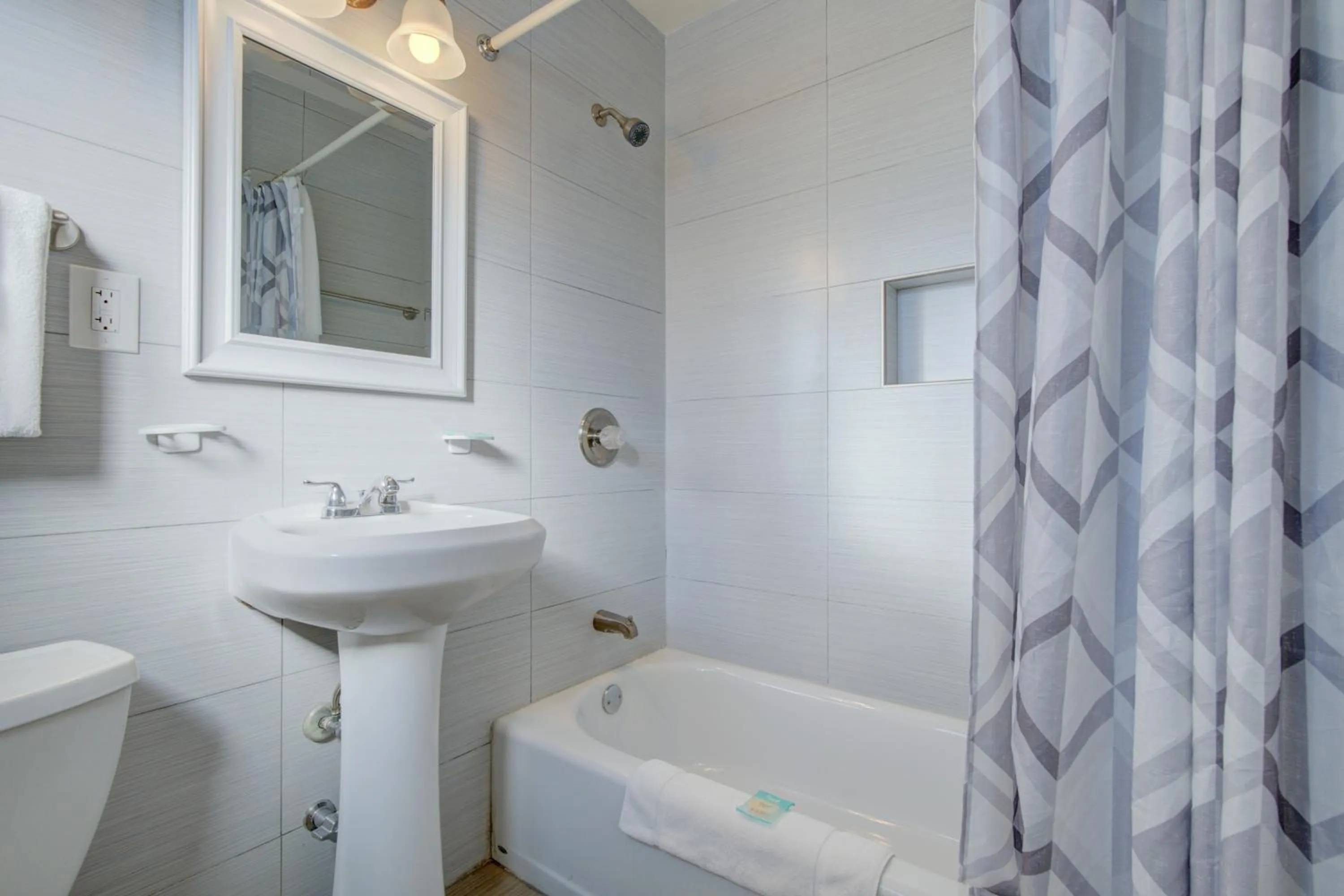 Bathroom in Leeward Motel By Capital O North Miami Beachside