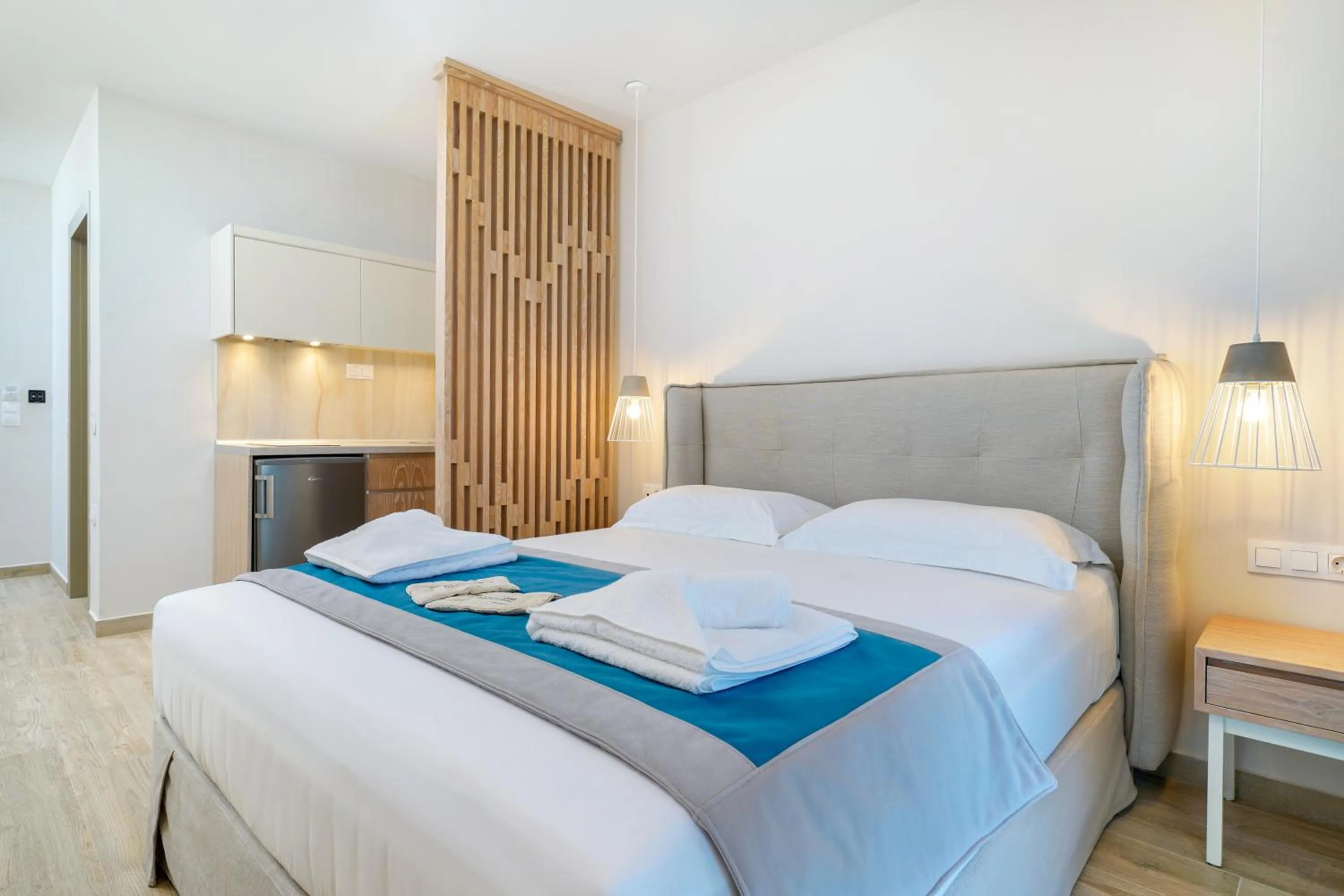 Photo of the whole room, Bed in Iliomagic Luxury Suites Thassos