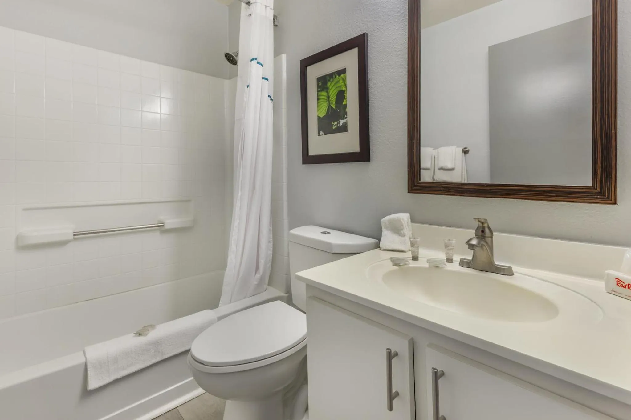 Bathroom in HomeTowne Studios & Suites by Red Roof Greensboro