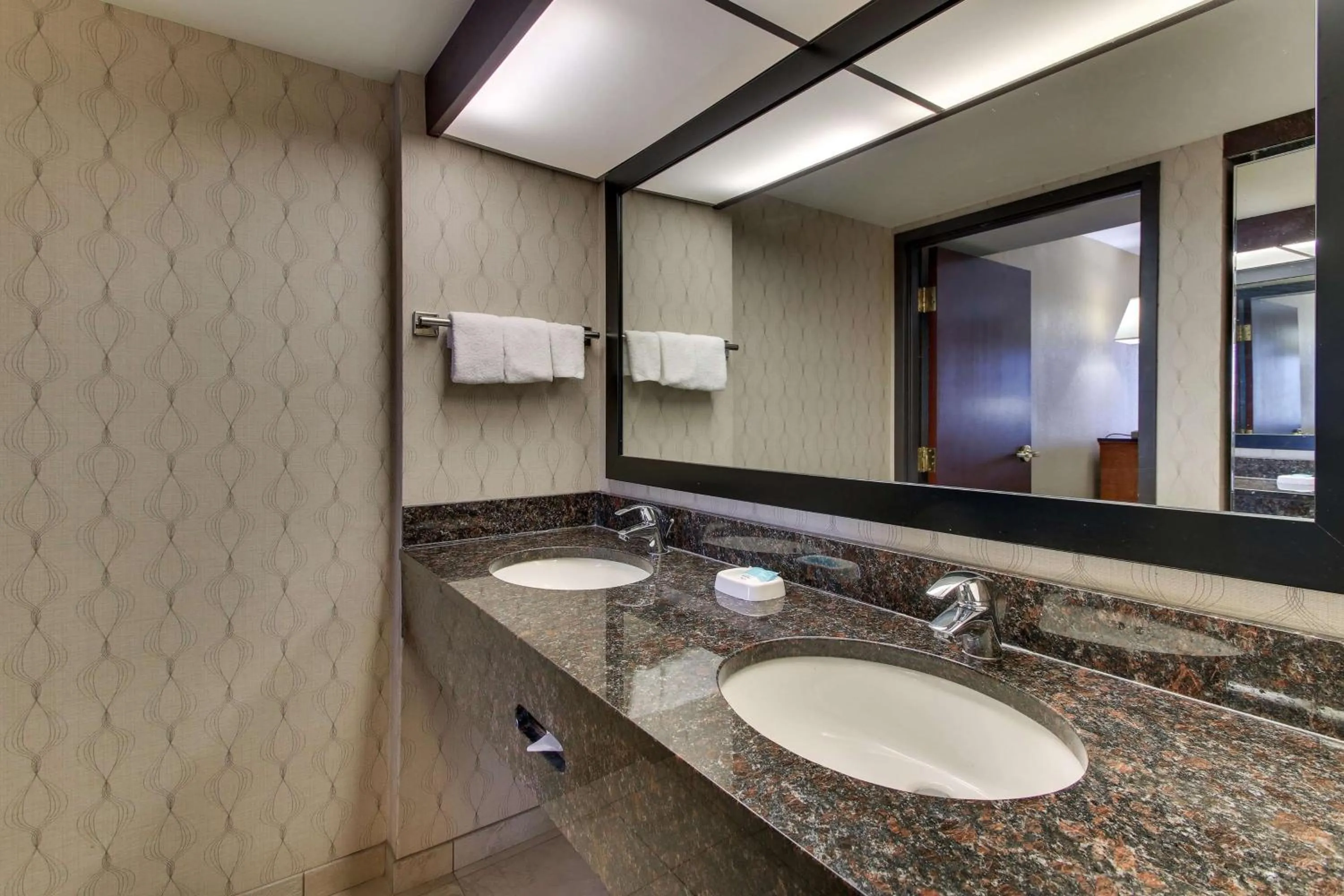 Bathroom in Heritage Inn Suites Houston Sugar Land, Trademark by Wyndham