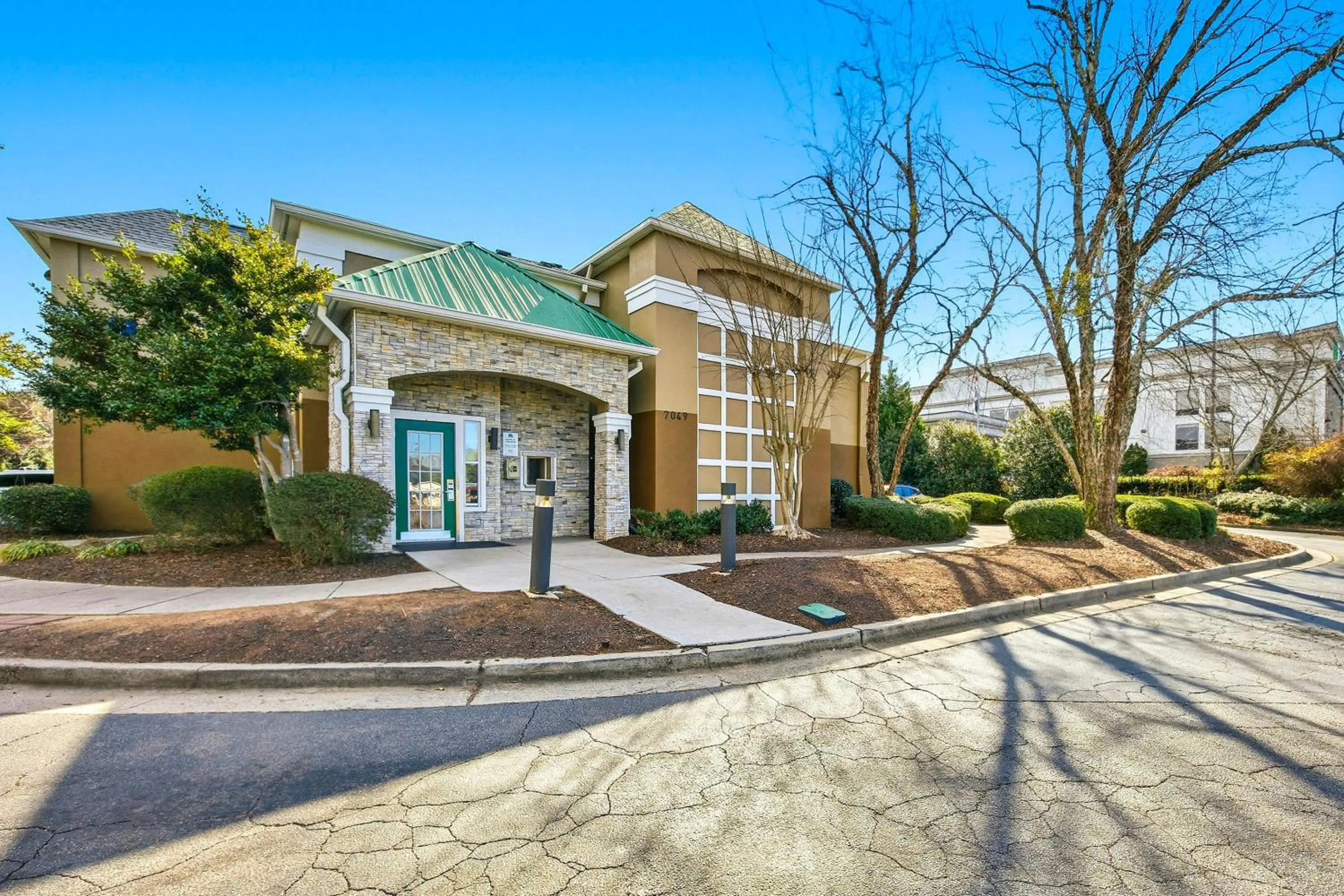 Property building in HomeTowne Studios by Red Roof Atlanta - Peachtree Corners