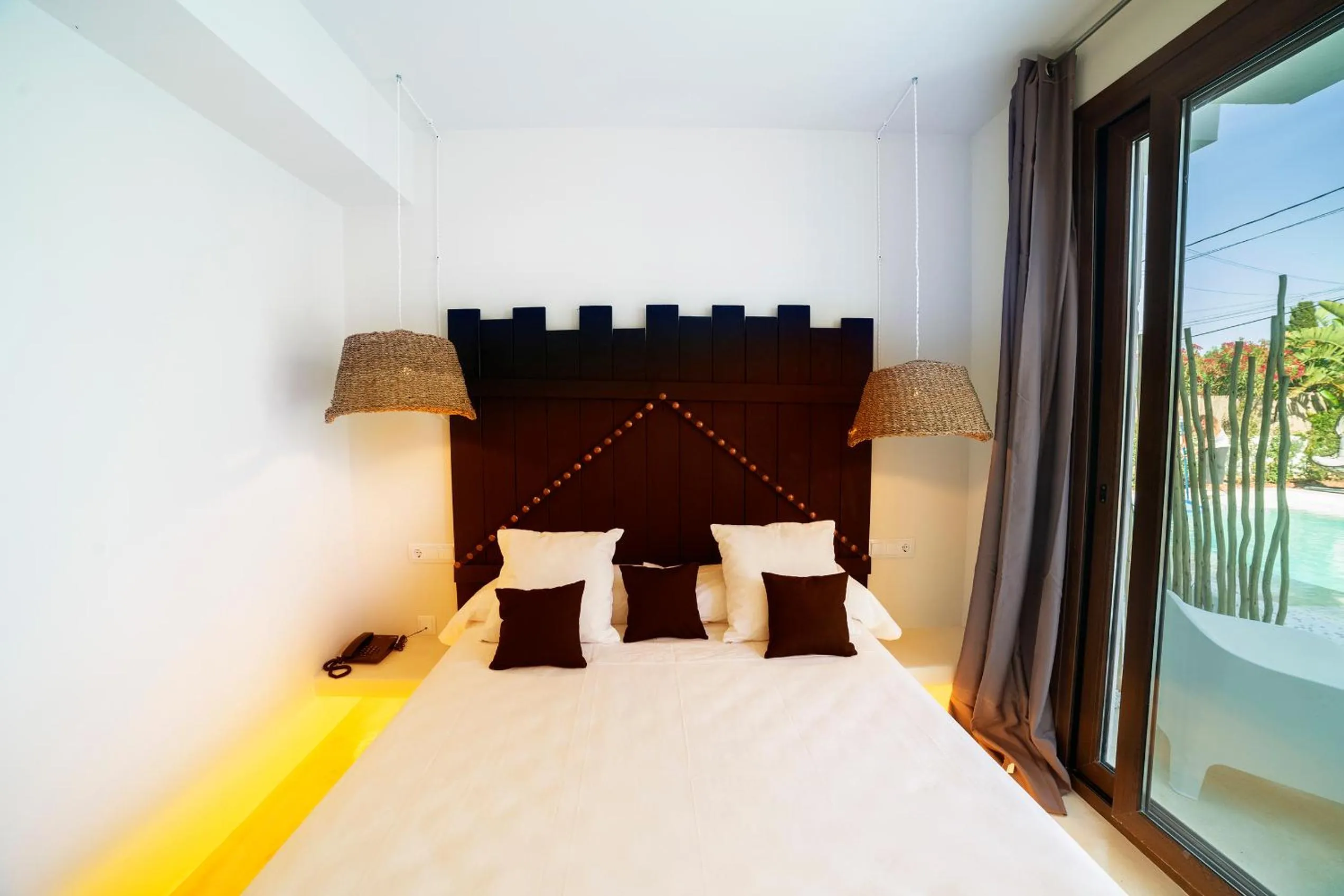 Bed in PAIISE Hotels